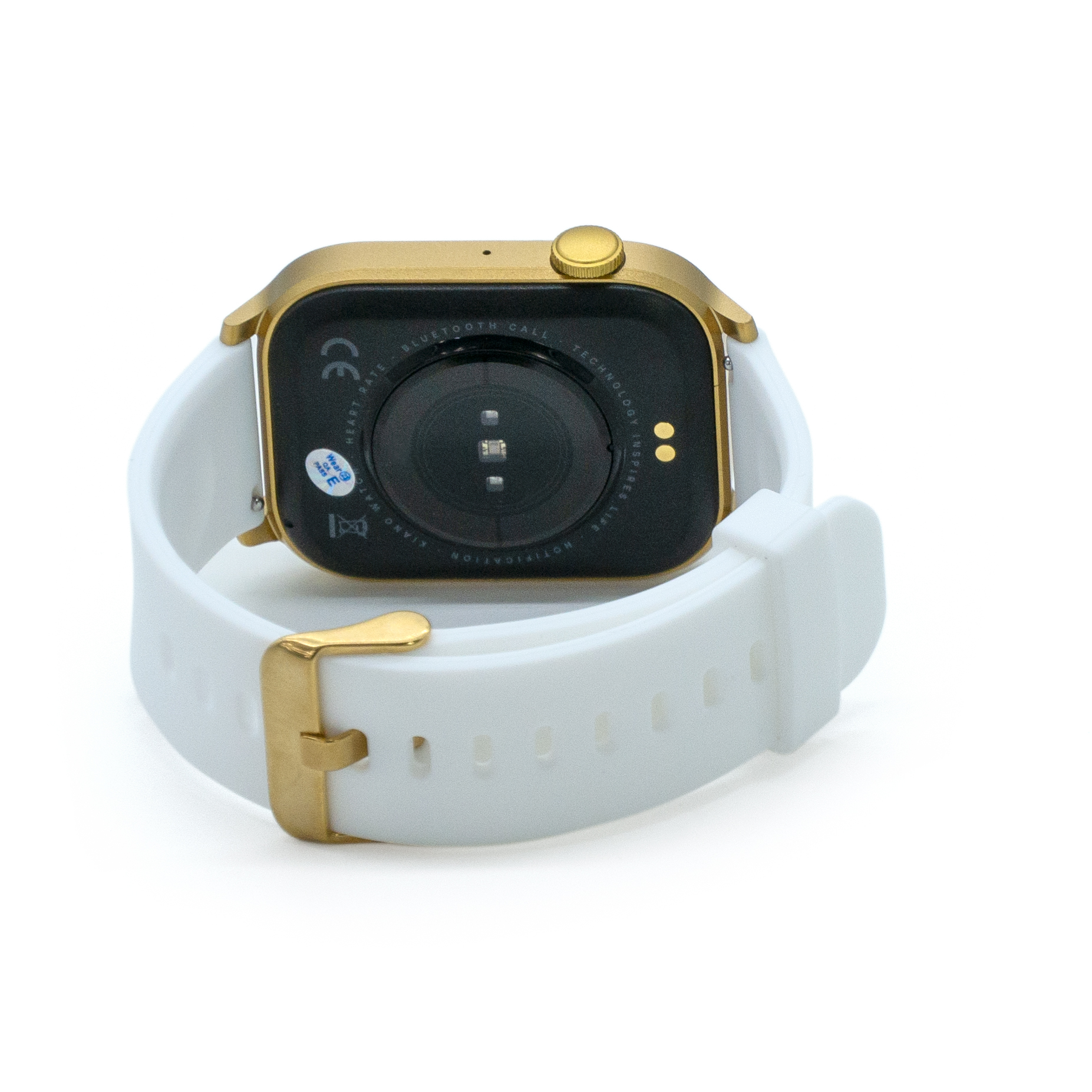 Złoty smartwatch z białym paskiem. Zegarek jest skierowany do góry, pokazując tył z czujnikami.