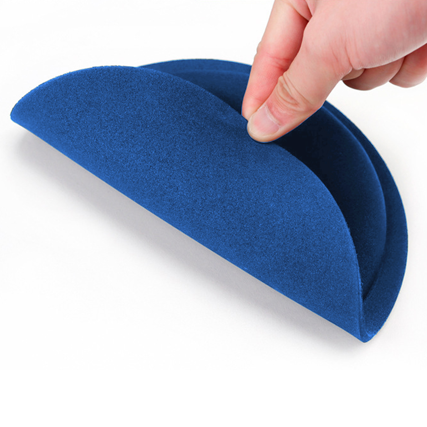 A hand holding open a blue, semi-circular, felt-like object against a white background.