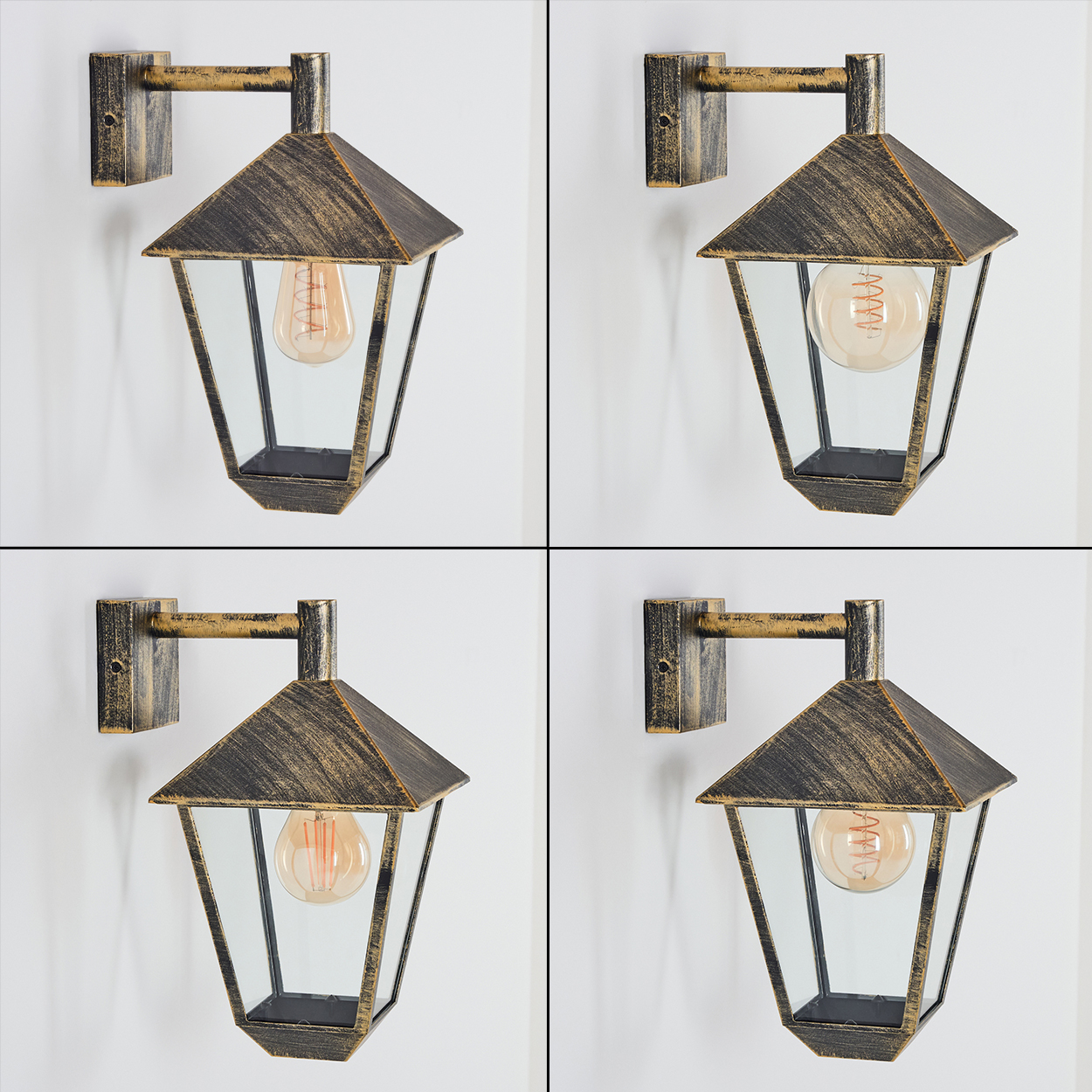 Vier Vintage-Wandlampen mit freiliegenden Glühbirnen, an einer weißen Wand befestigt. Jede Lampe hat ein Schwarz-Gold-Finish.