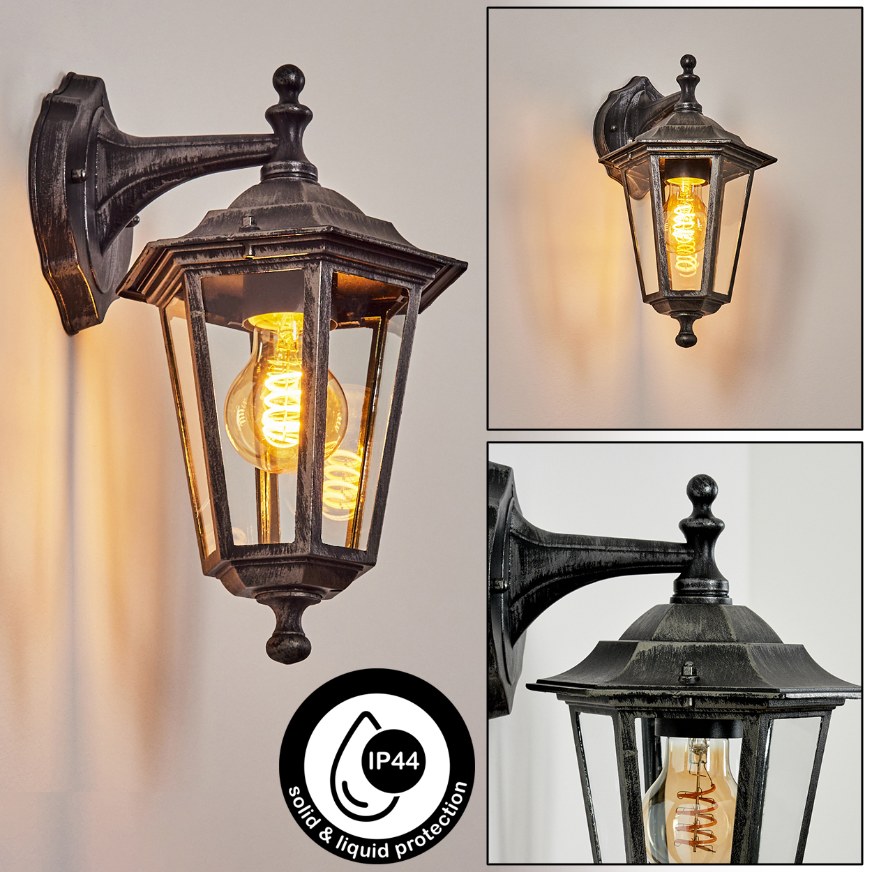 Eine schwarz-goldene Wandlampe mit einer Glühbirne in einem Glaskasten. IP44-Symbol sichtbar.