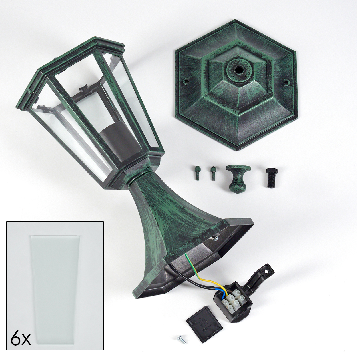 Zerlegte grüne Lampe mit Komponenten: Glas, Sockel, Schrauben und Verkabelung, sowie ein Seitendetail.