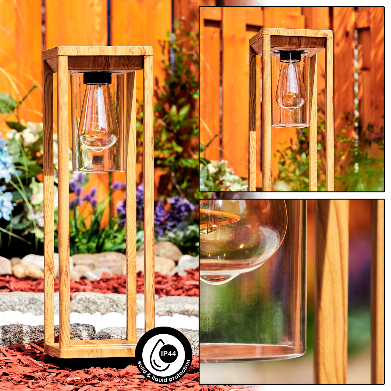 Holzgerahmte Lampe mit langer Glühbirne in einem Glaszylinder. Die Lampe befindet sich in einem Garten mit Holzzaun.