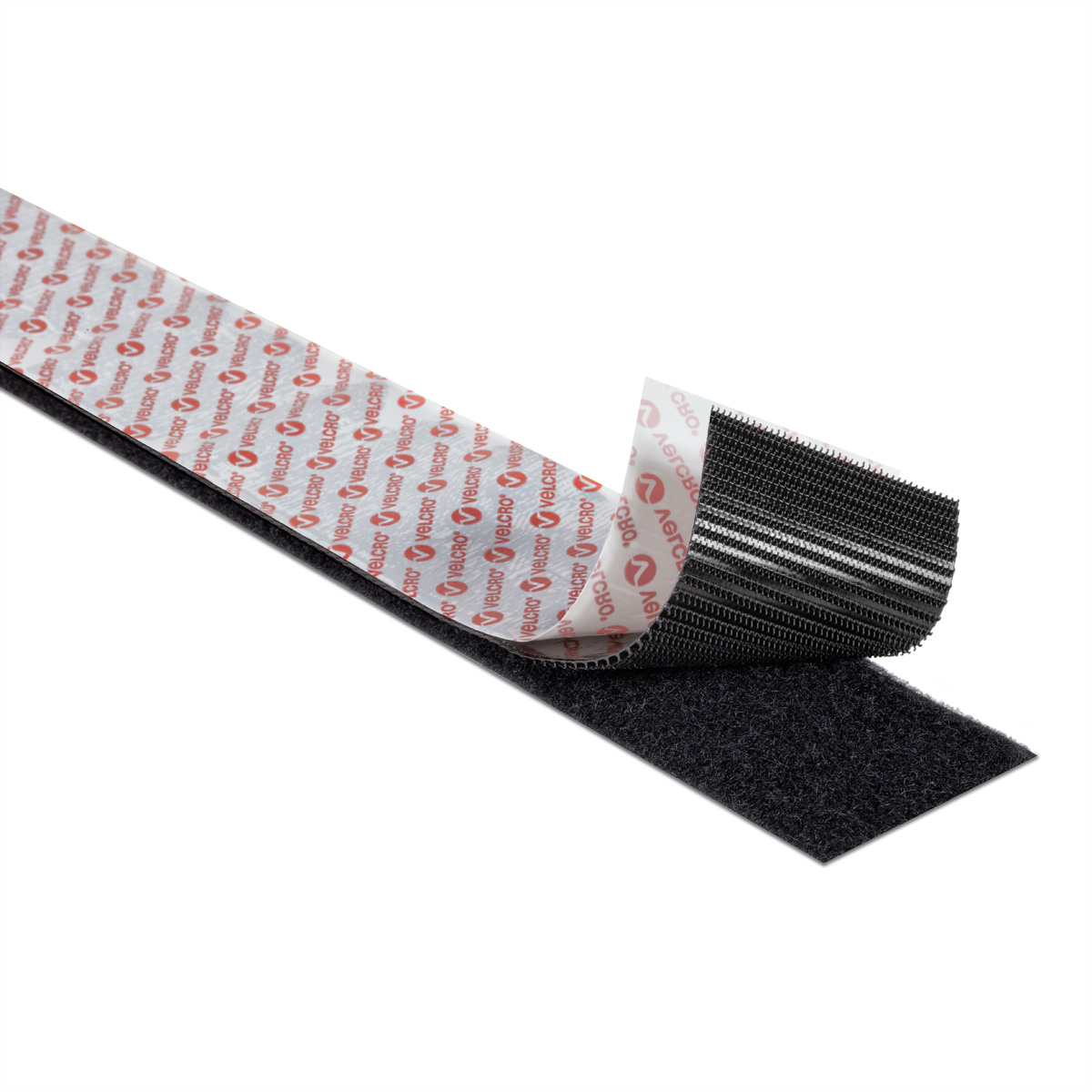 Zwarte klittenbandstrip met een witte achterkant met het 'VELCRO'-logo.