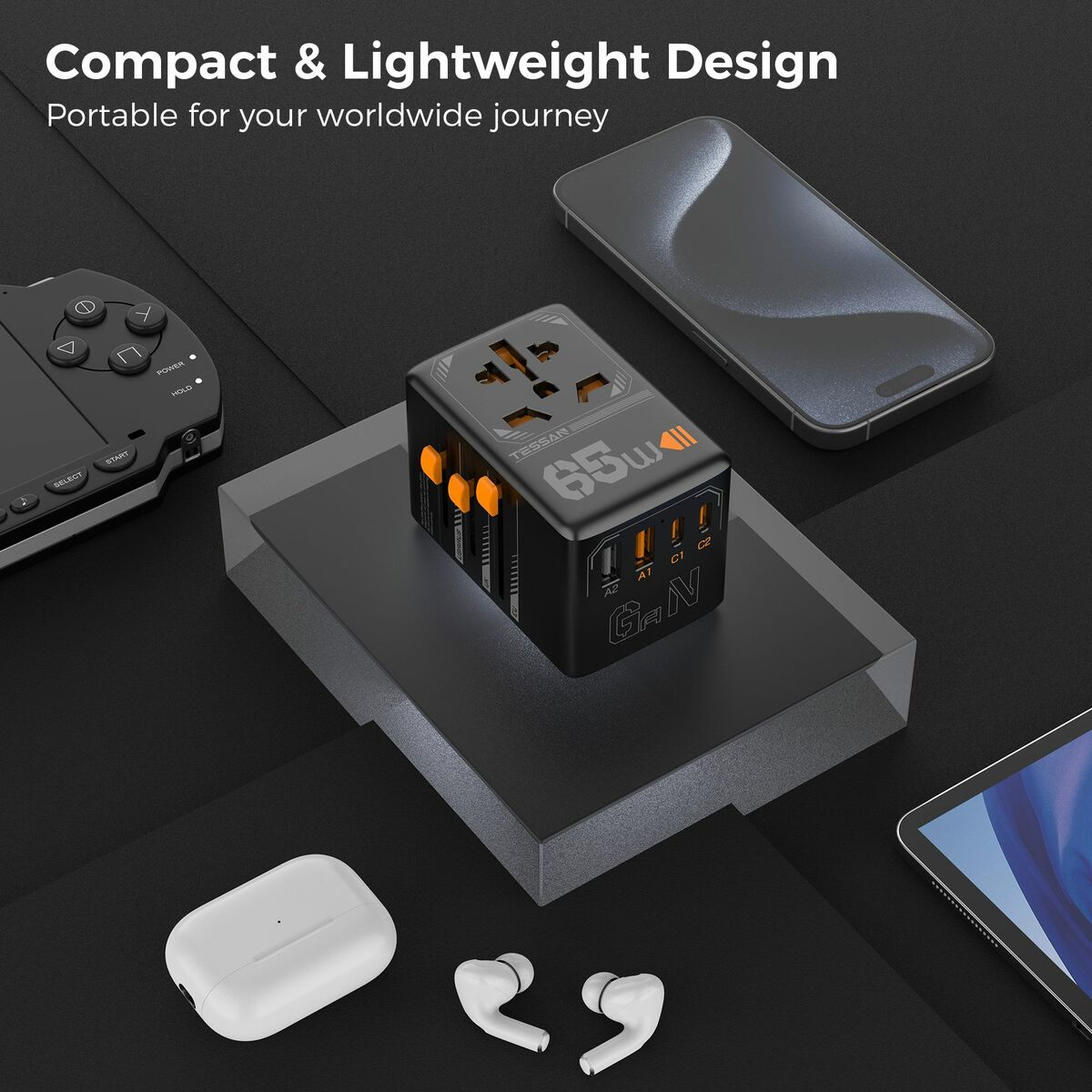 Adaptador de corriente negro y naranja con múltiples puertos y dispositivos sobre superficie oscura.