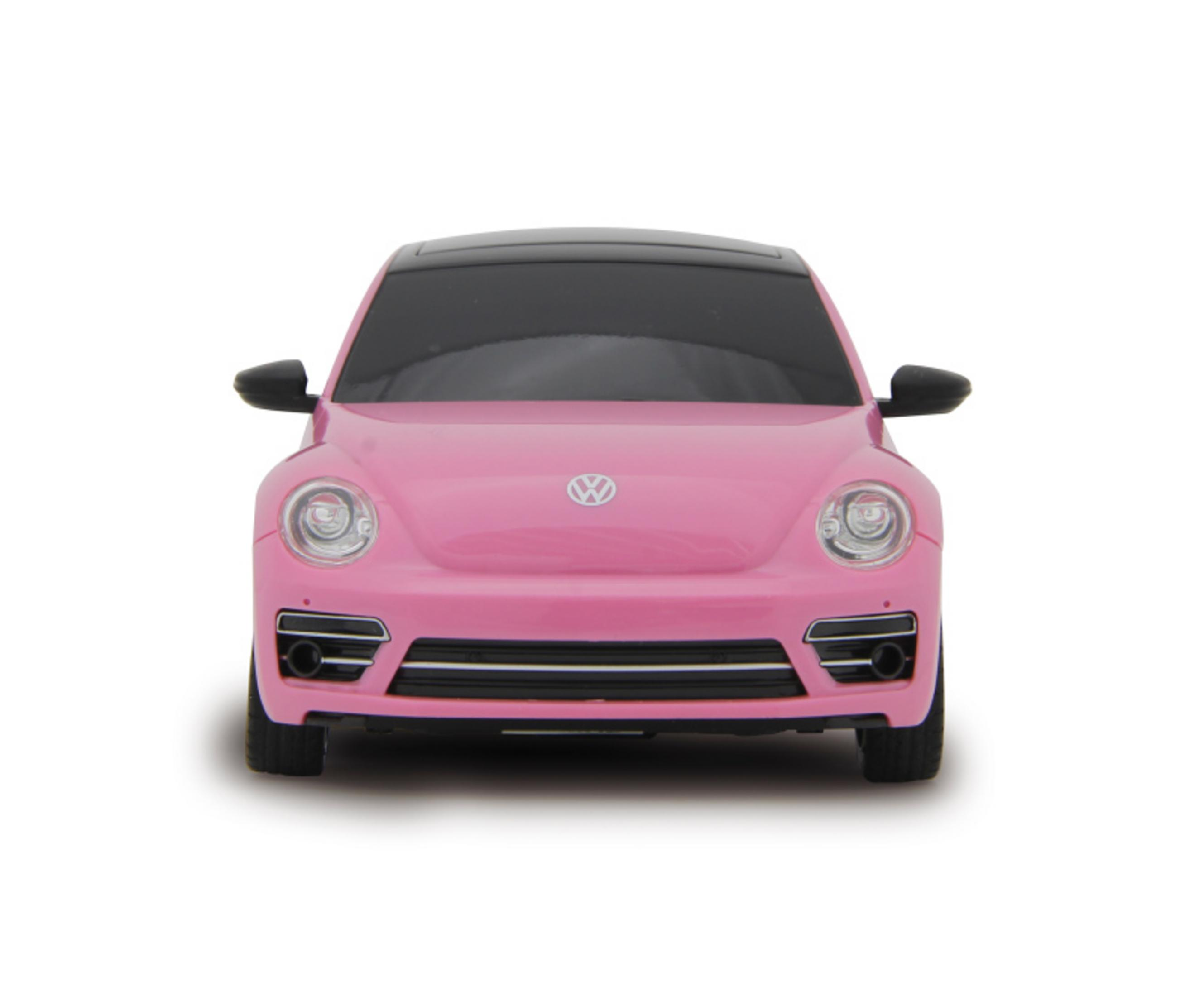 Vorderansicht eines rosa VW Käfers mit schwarzen Akzenten auf weißem Grund.