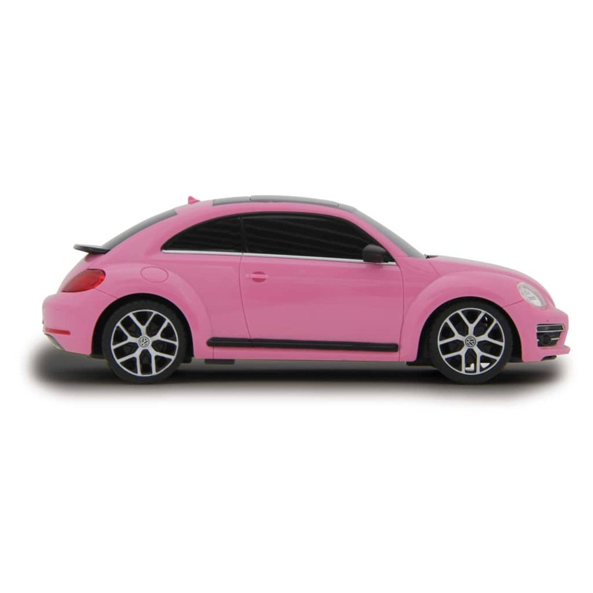 Seitenansicht eines rosa VW Käfers mit schwarzen Akzenten auf weißem Grund.