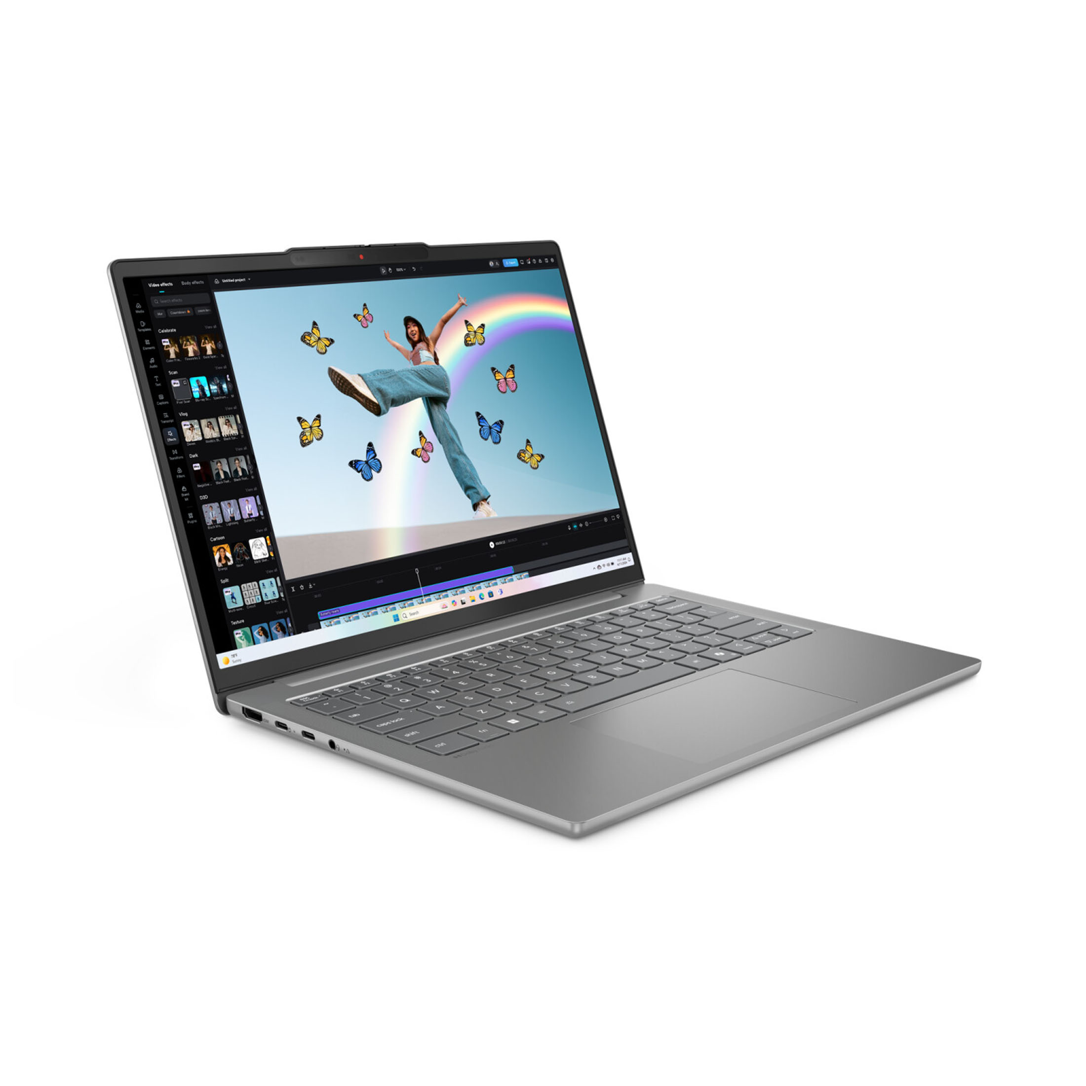 Ein grauer Laptop zeigt eine Videoschnittstelle. Eine Frau springt, mit Schmetterlingen und einem Regenbogen auf dem Bildschirm.