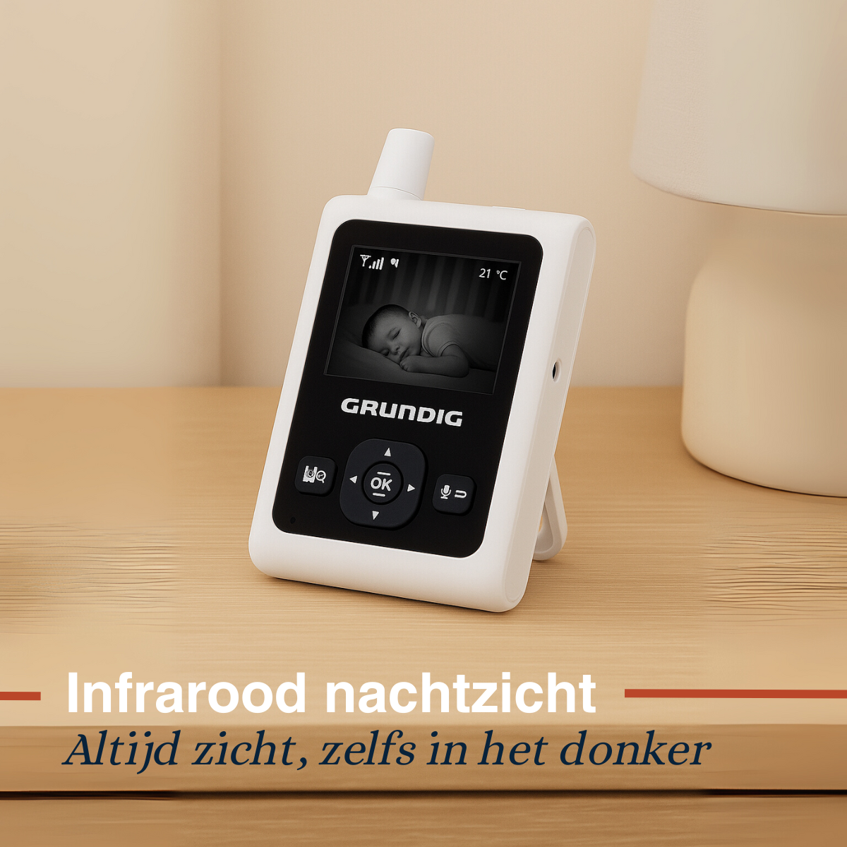 A baby monitor with a screen showing a baby sleeping, and a label with infrared night vision.