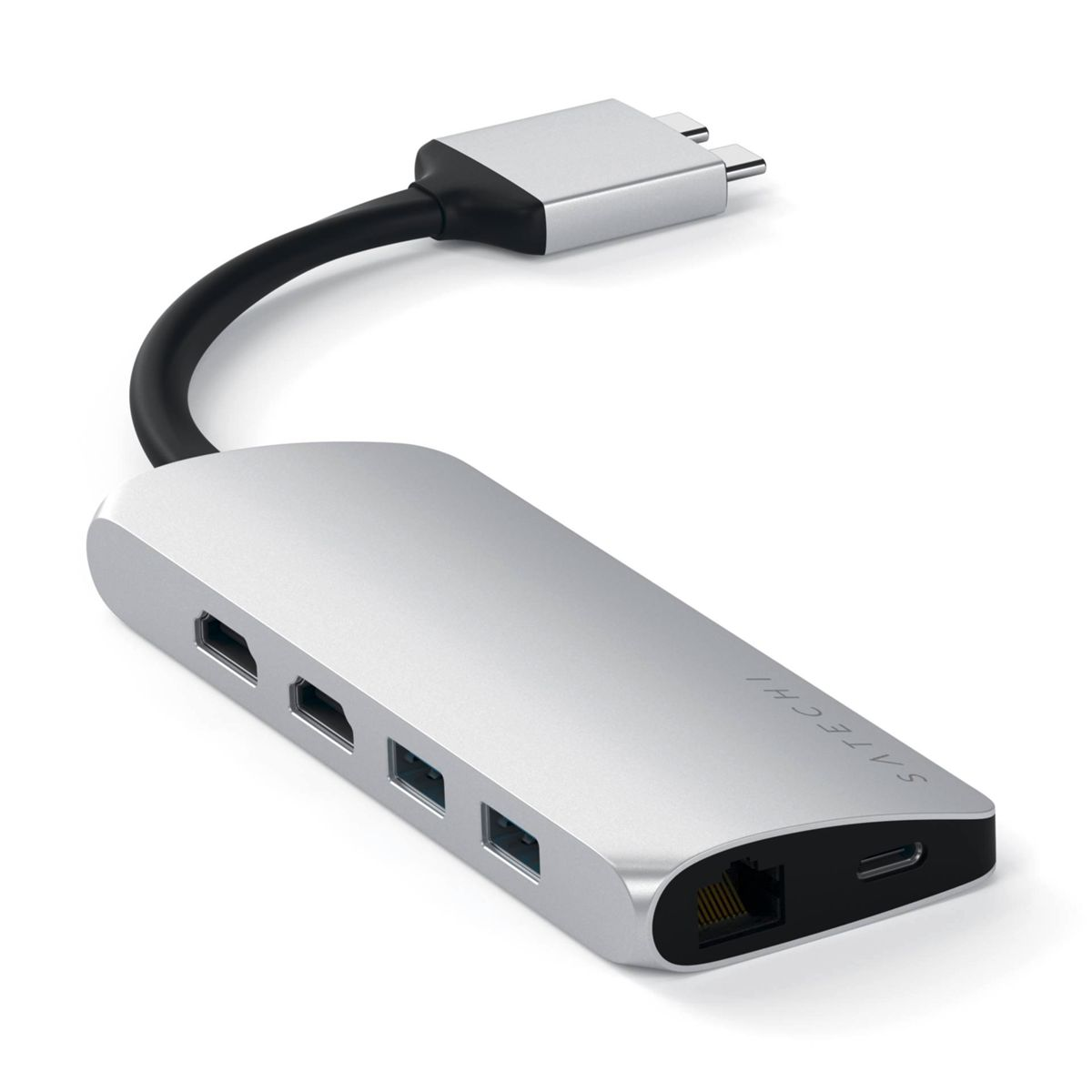 Hub USB argentato con più porte collegato a una superficie bianca. Ha più porte.
