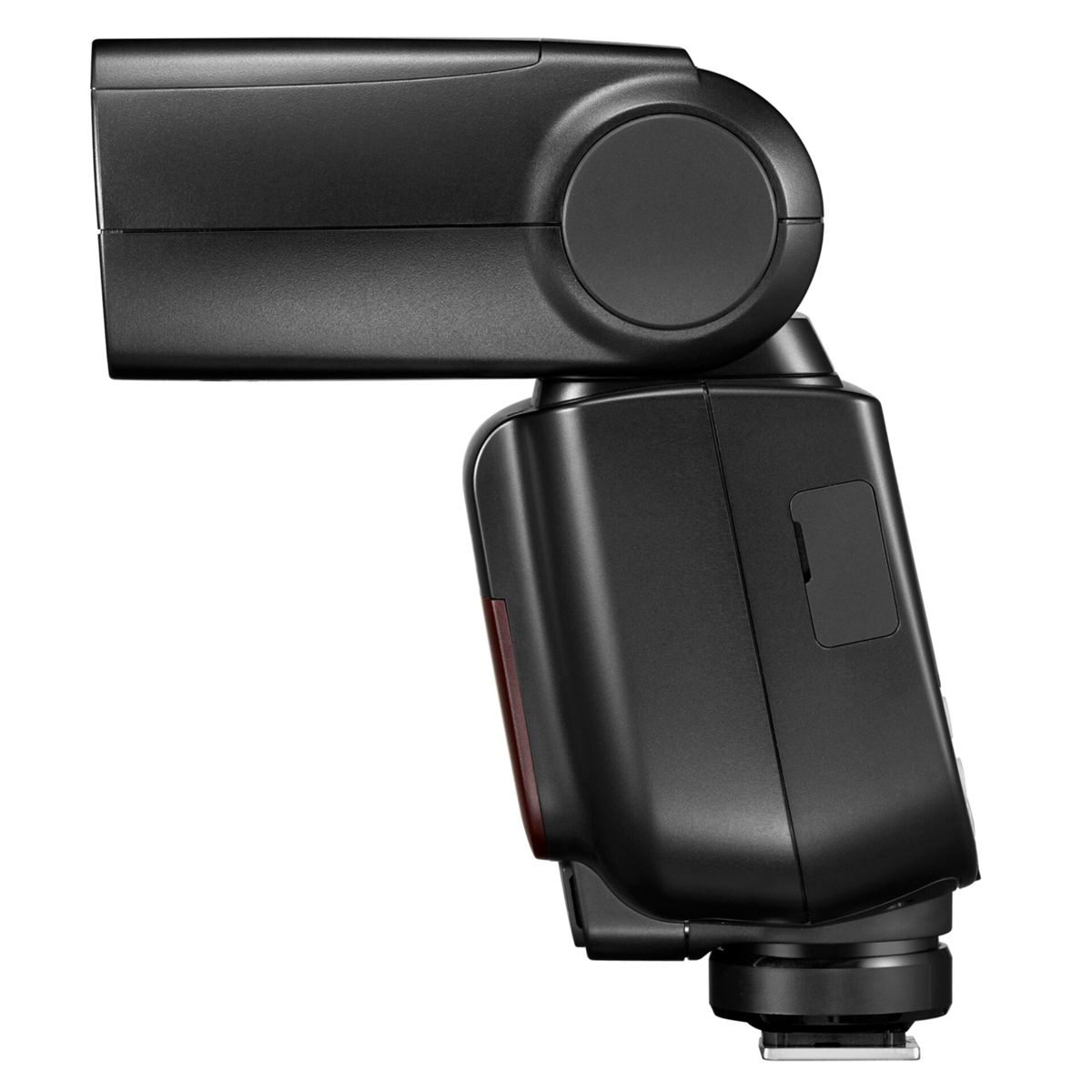 Czarna lampa błyskowa pochylona lekko na bok, z czerwonym panelem z boku.