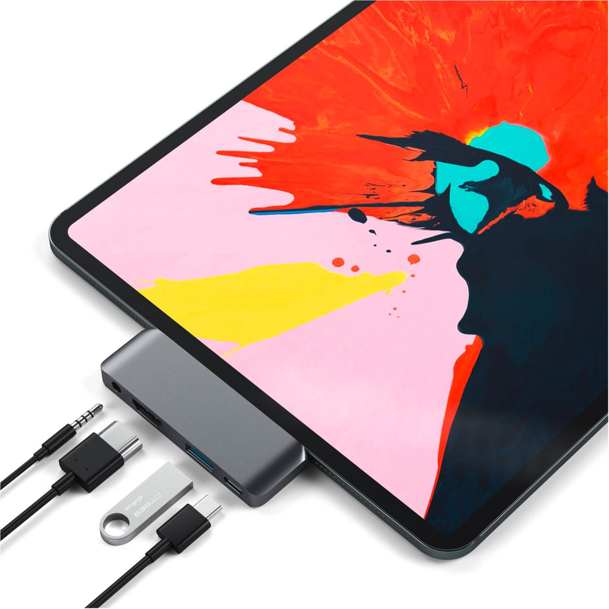 Un tablet con hub USB, cavi e chiavetta USB. Il tablet mostra un design astratto colorato.