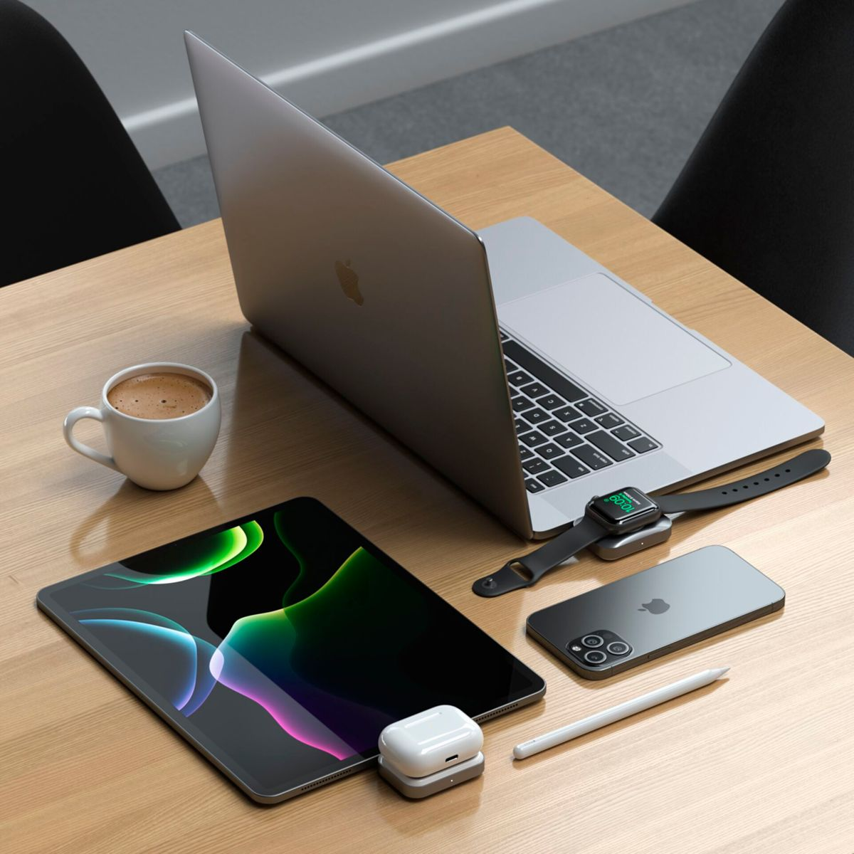 Un escritorio con una laptop, tableta, teléfono, reloj, auriculares y una taza de café.