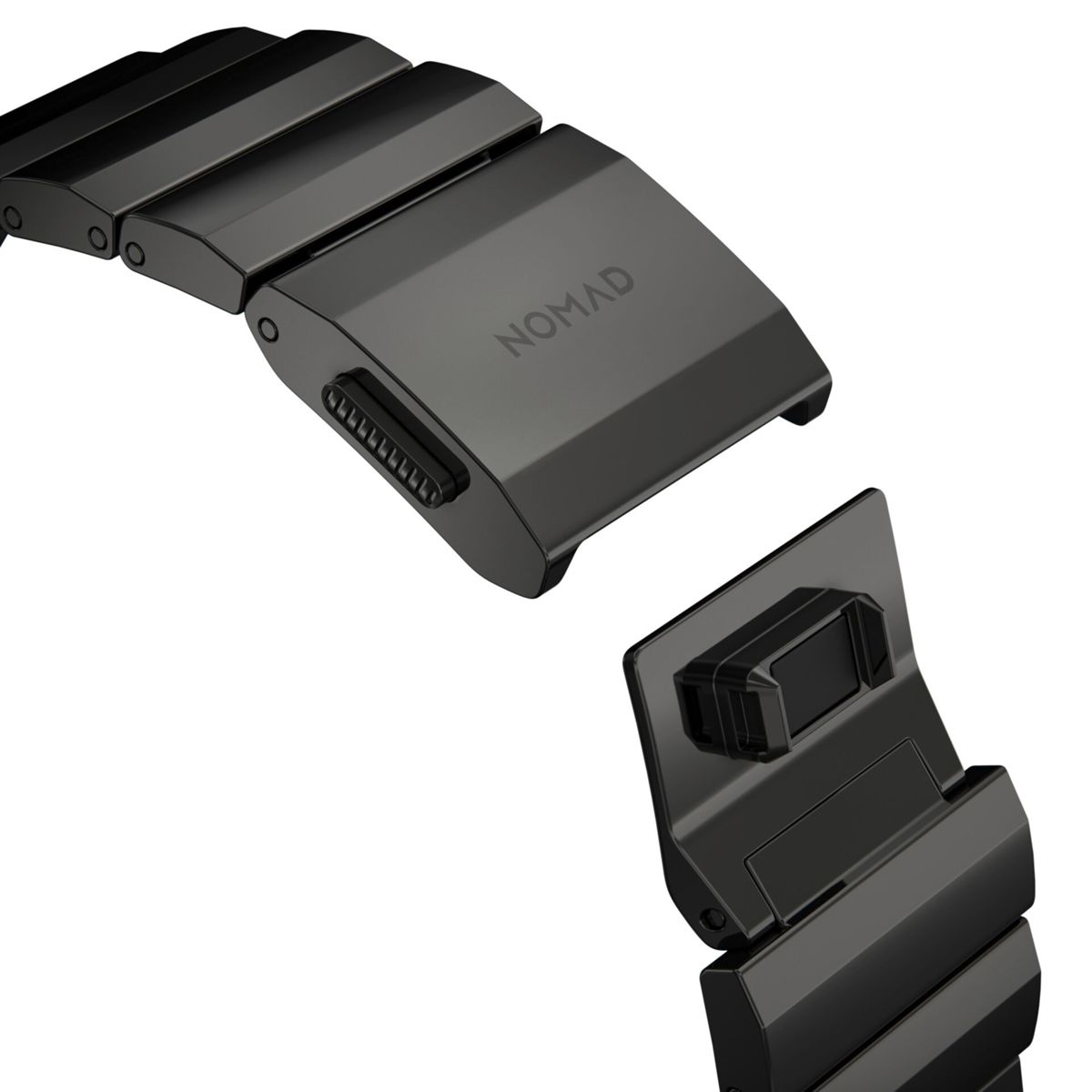 Nahaufnahme eines schwarzen Metalluhrenarmbandverschlusses. Das Wort NOMAD ist auf dem Verschluss sichtbar.
