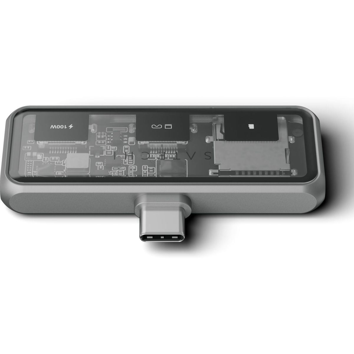 Un adattatore argentato con connettore USB-C e parte superiore trasparente, che mostra i componenti interni.