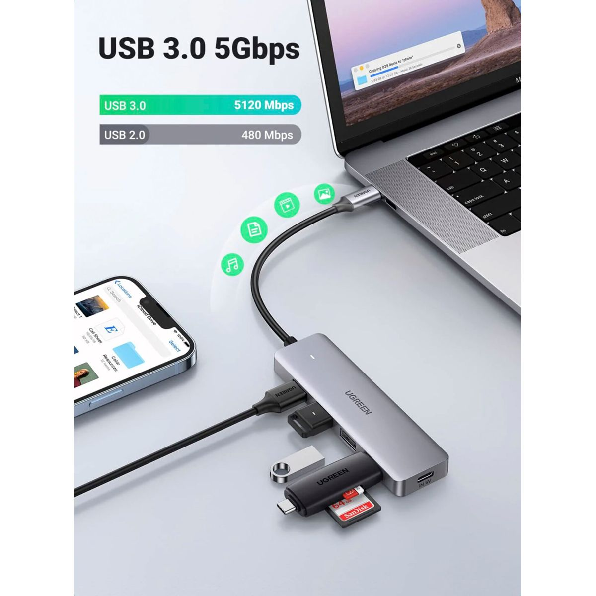 Srebrny hub podłączony do laptopa i różnych urządzeń, z tekstem o USB 3.0.