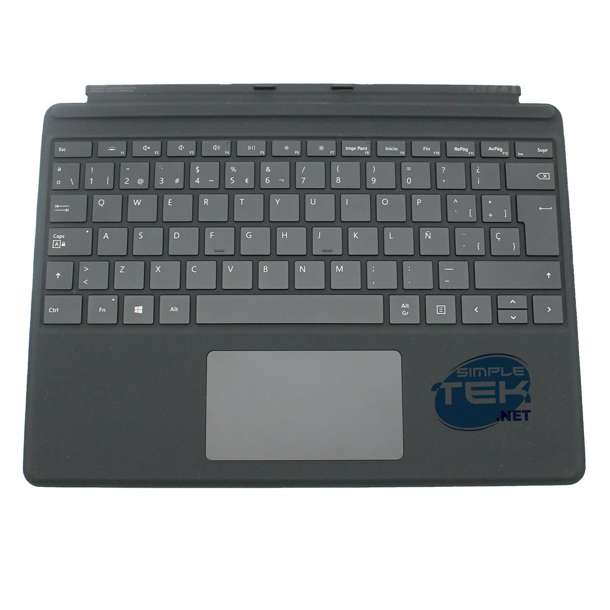 Cubierta de teclado gris con teclas y panel táctil. Tiene una etiqueta que dice simple tek net.