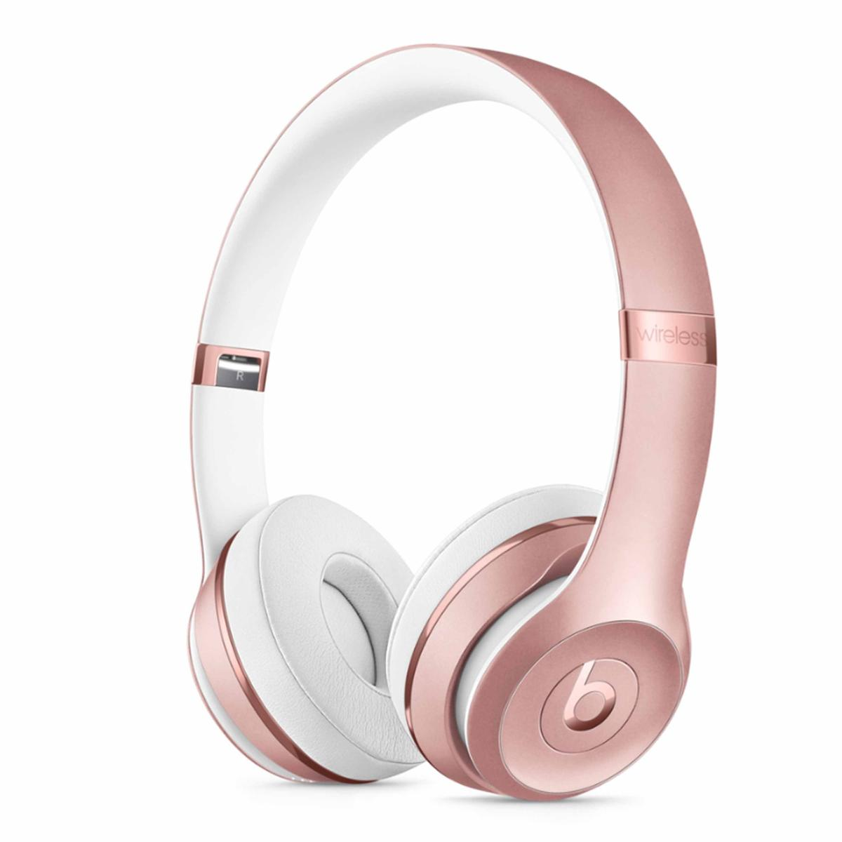Cuffie wireless Beats Solo3 rosa oro e bianche. Il logo Beats è visibile sul padiglione auricolare.