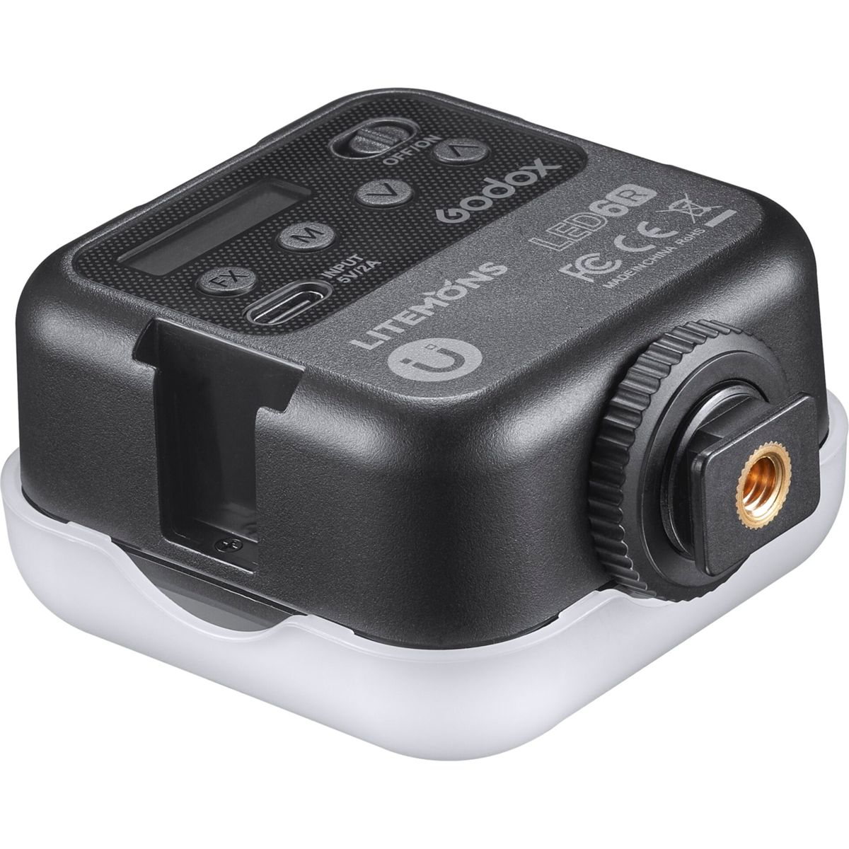 Czarno-białe światło LED. Ma przyciski, wyświetlacz i logo. Zamontowane na białej podstawie.