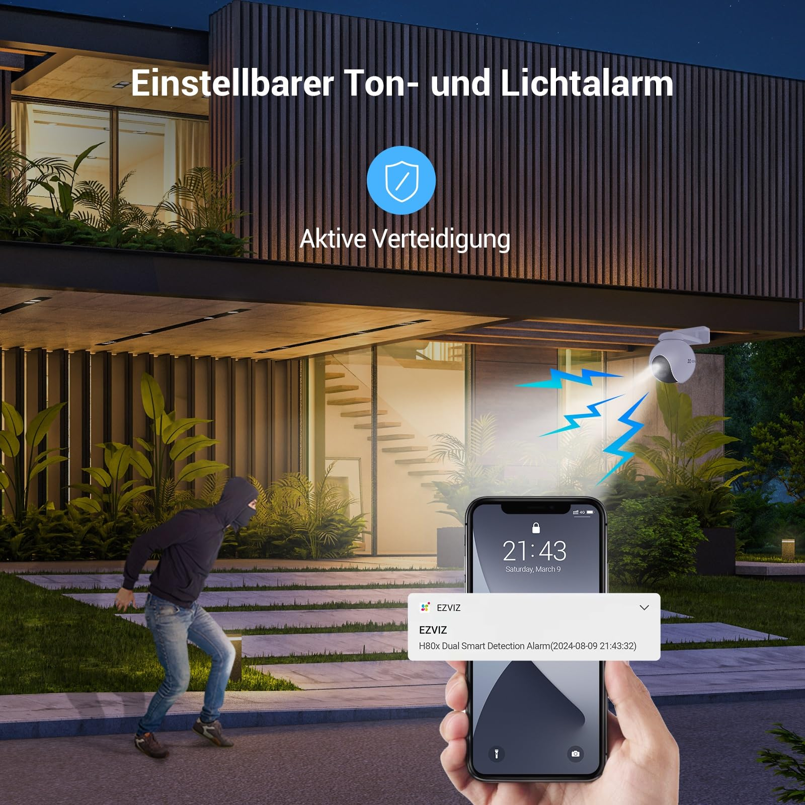 Eine Person wird auf einem Smartphone über einen Einbruch alarmiert, im Hintergrund eine Überwachungskamera und ein Haus.