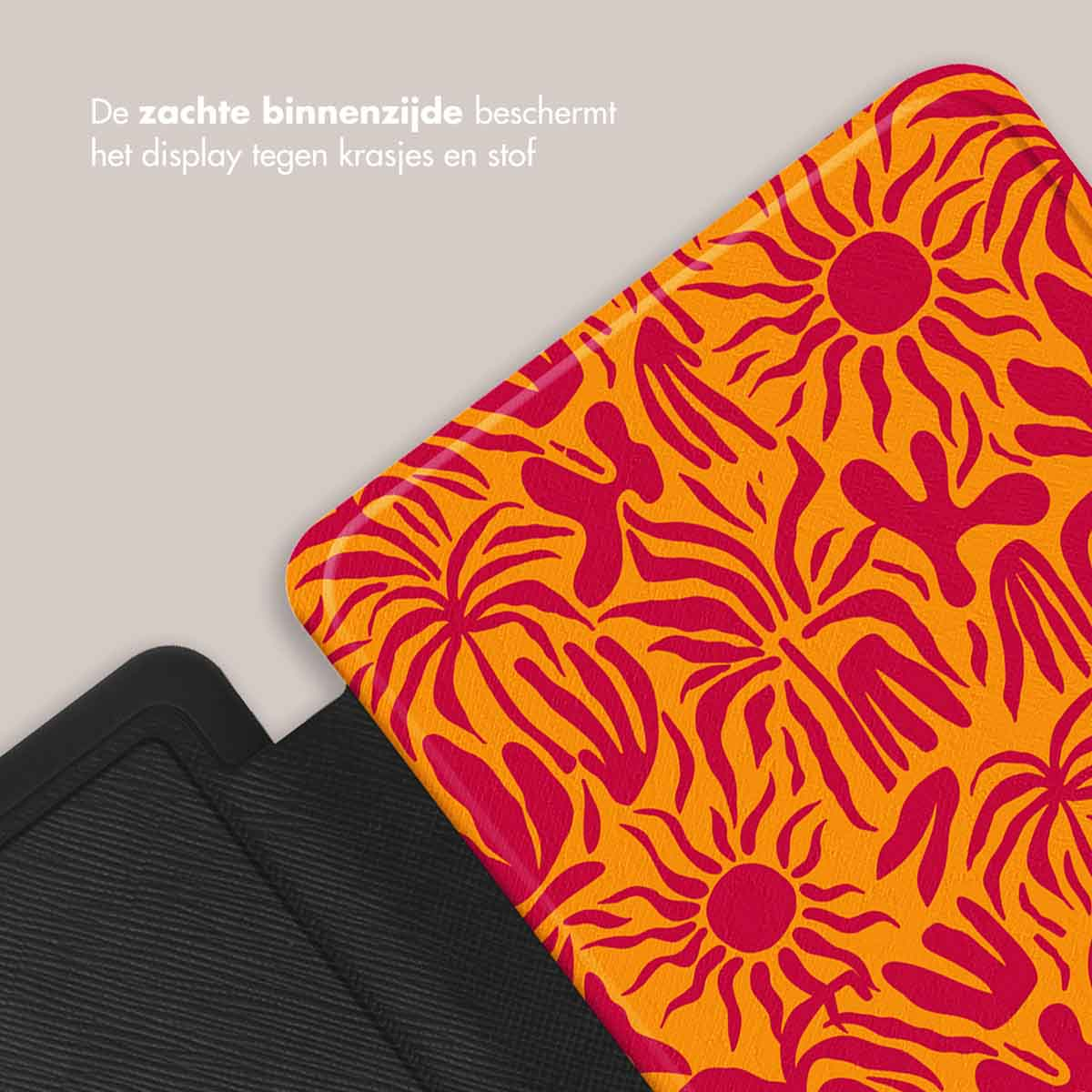 Primo piano di una copertina di e-reader con un design floreale rosso e arancione con testo in olandese sullo schermo.