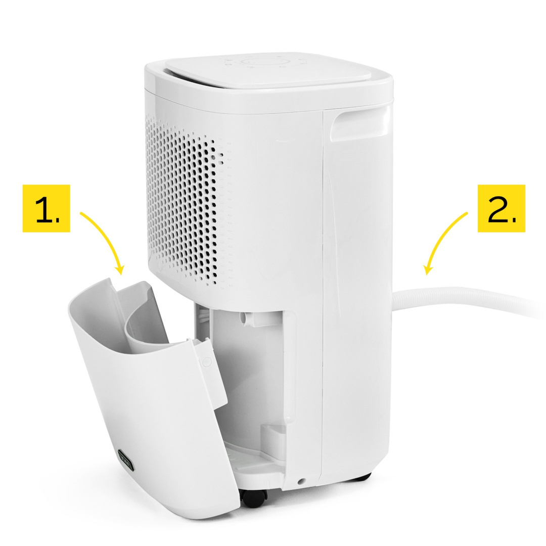 Biały osuszacz z otwartą komorą na zbiornik wody. Szczegóły ze strzałkami i etykietami.