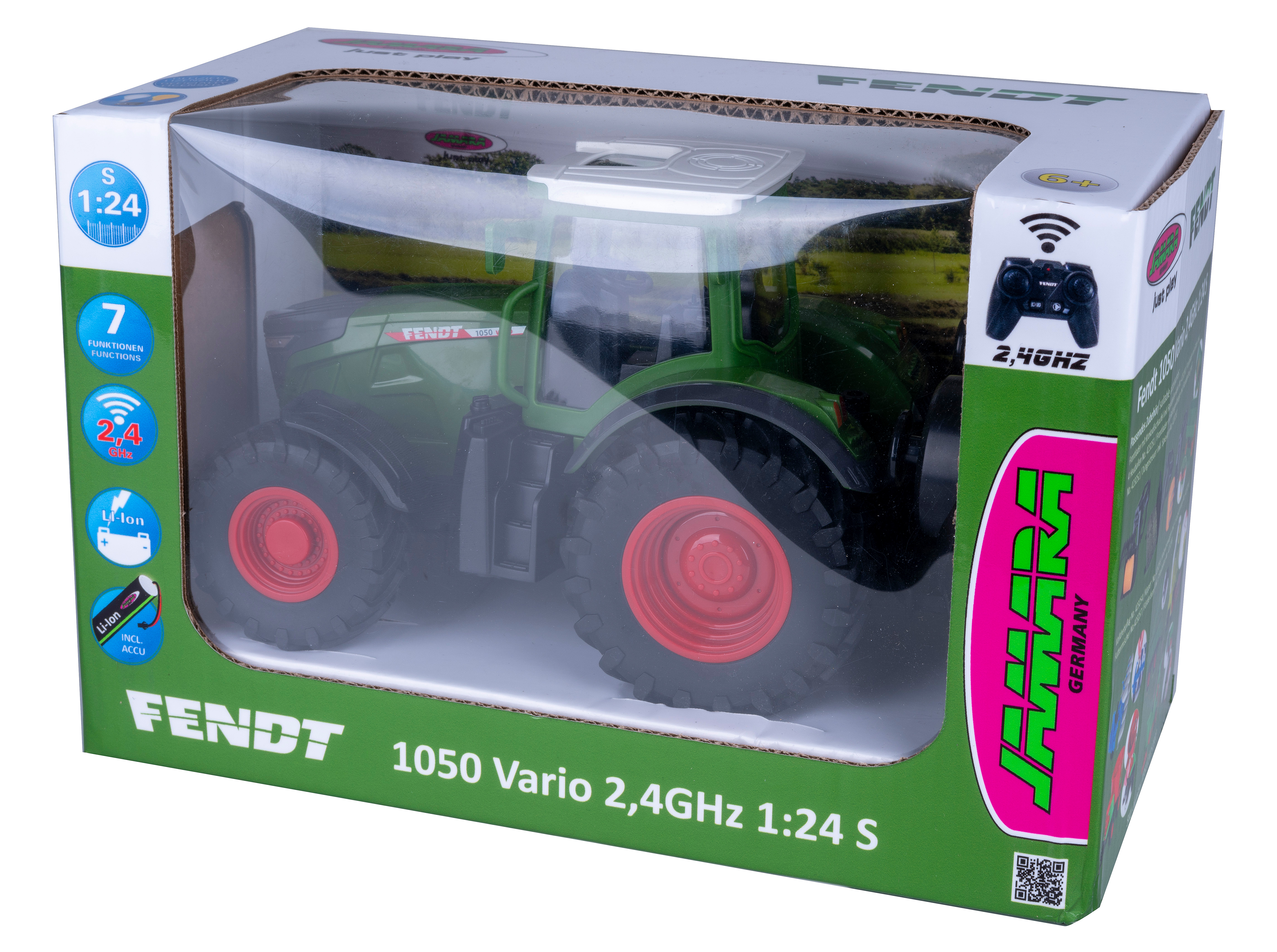 Ein Spielzeugtraktor in einer Box. Der Traktor ist grün mit schwarzen Reifen und roten Felgen. Die Box ist grün und weiß.