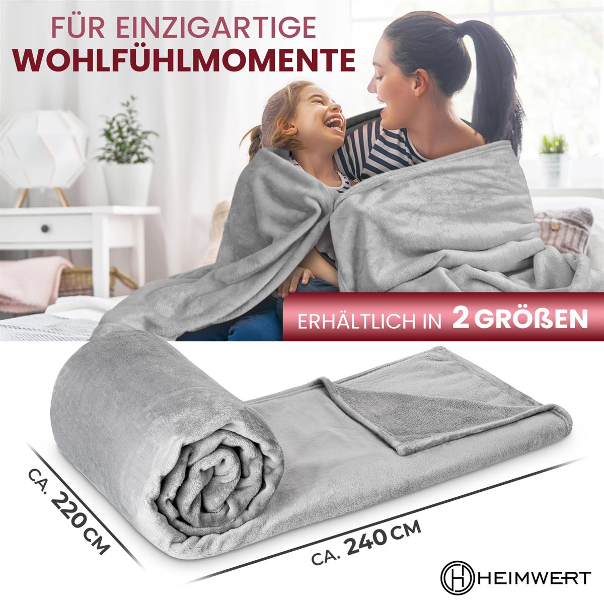 Eine Frau und ein Kind sind in eine graue Decke gehüllt. Eine gerollte Decke wird gezeigt.