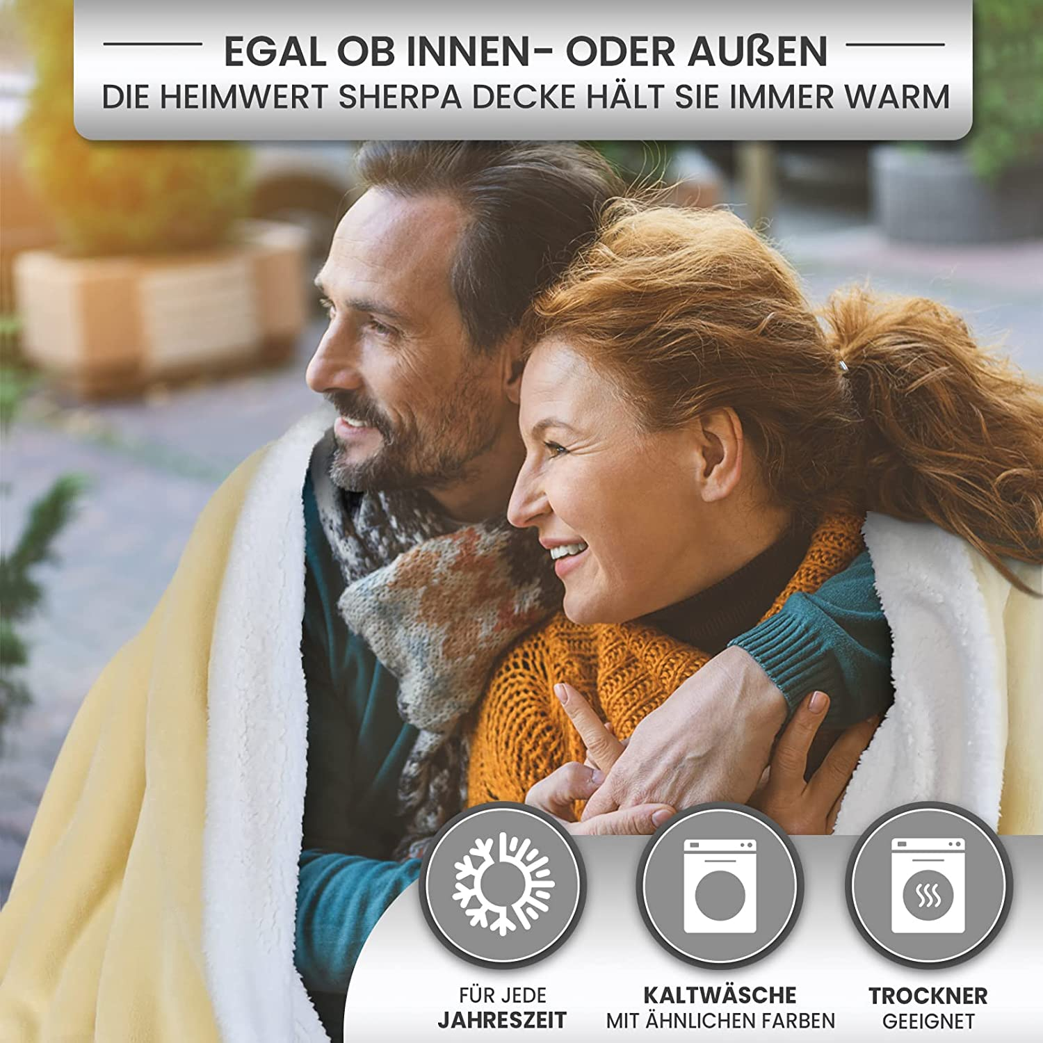Ein Paar ist mit einer gelben Decke bedeckt. Der Text ist sichtbar, zusammen mit Symbolen.