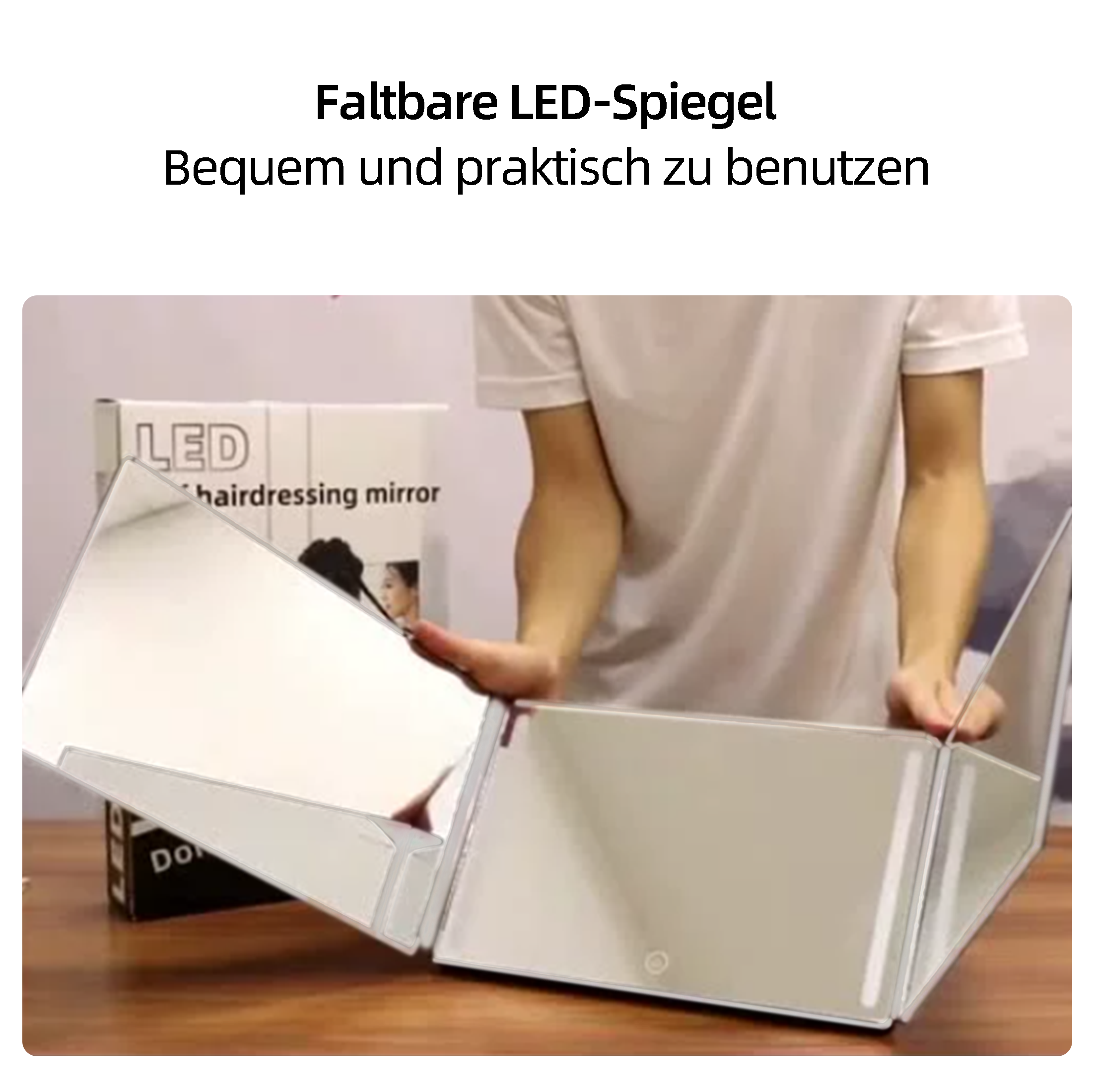 Eine Person benutzt einen faltbaren LED-Spiegel. Der Spiegel ist geöffnet und zeigt seine Oberfläche.