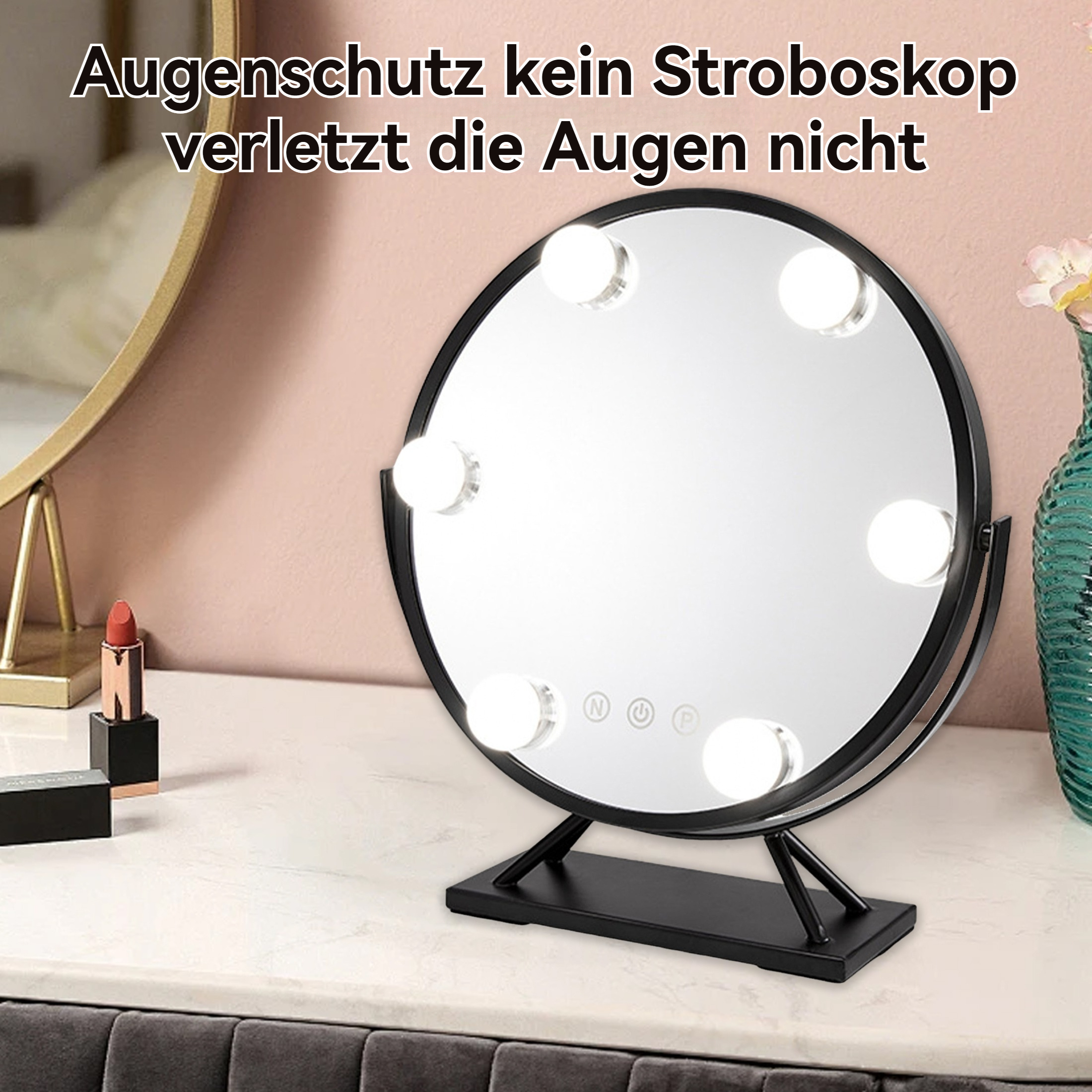 Runder schwarzer Schminkspiegel mit Lichtern auf einem Tisch. Ein Lippenstift und andere Make-up-Artikel sind sichtbar.