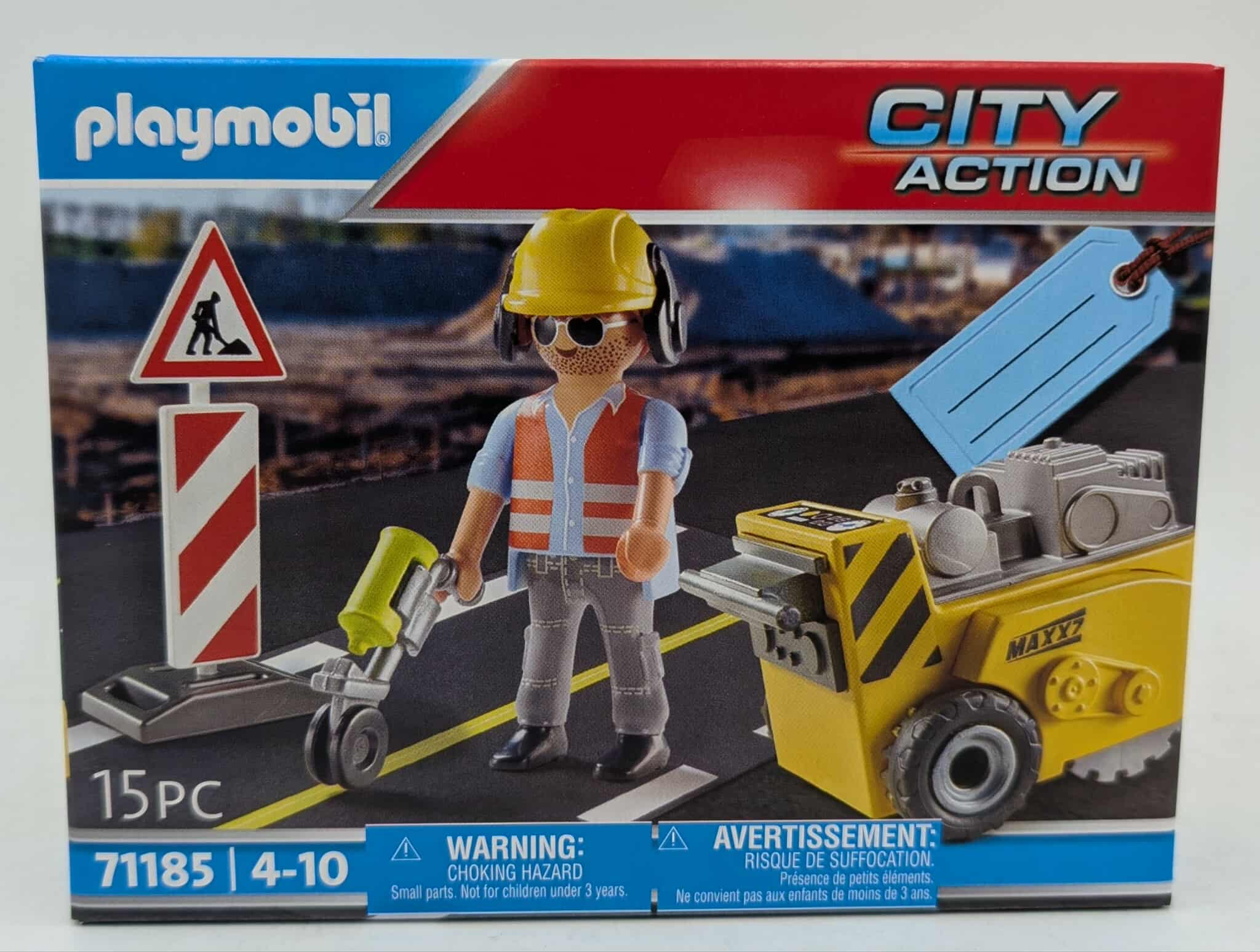 Eine Playmobil City Action Box zeigt einen Bauarbeiter, Straßenschilder und Straßenbaumaschinen.