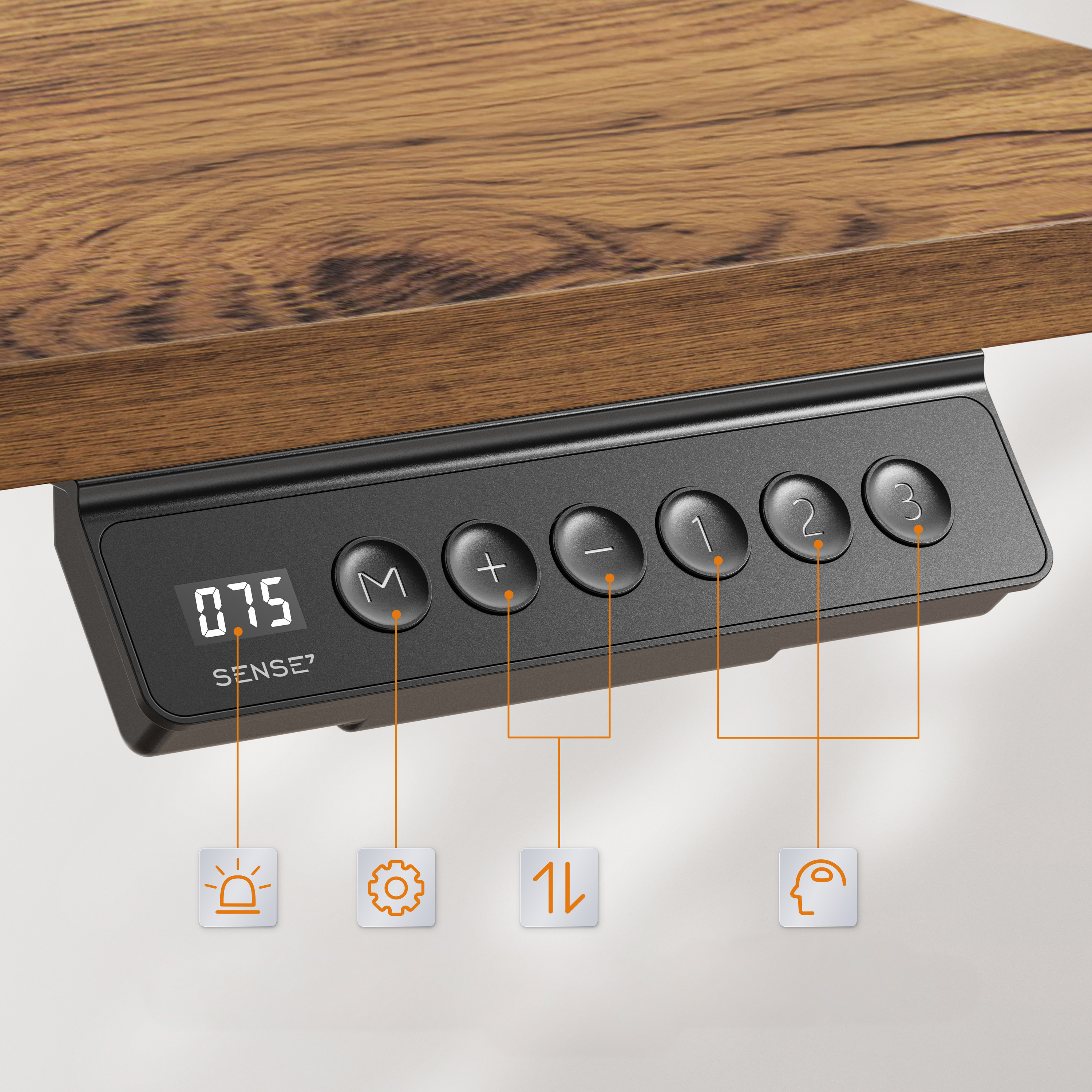Nahaufnahme eines schwarzen Bedienfelds mit Knöpfen und digitaler Anzeige, unter einem Holzschreibtisch montiert.
