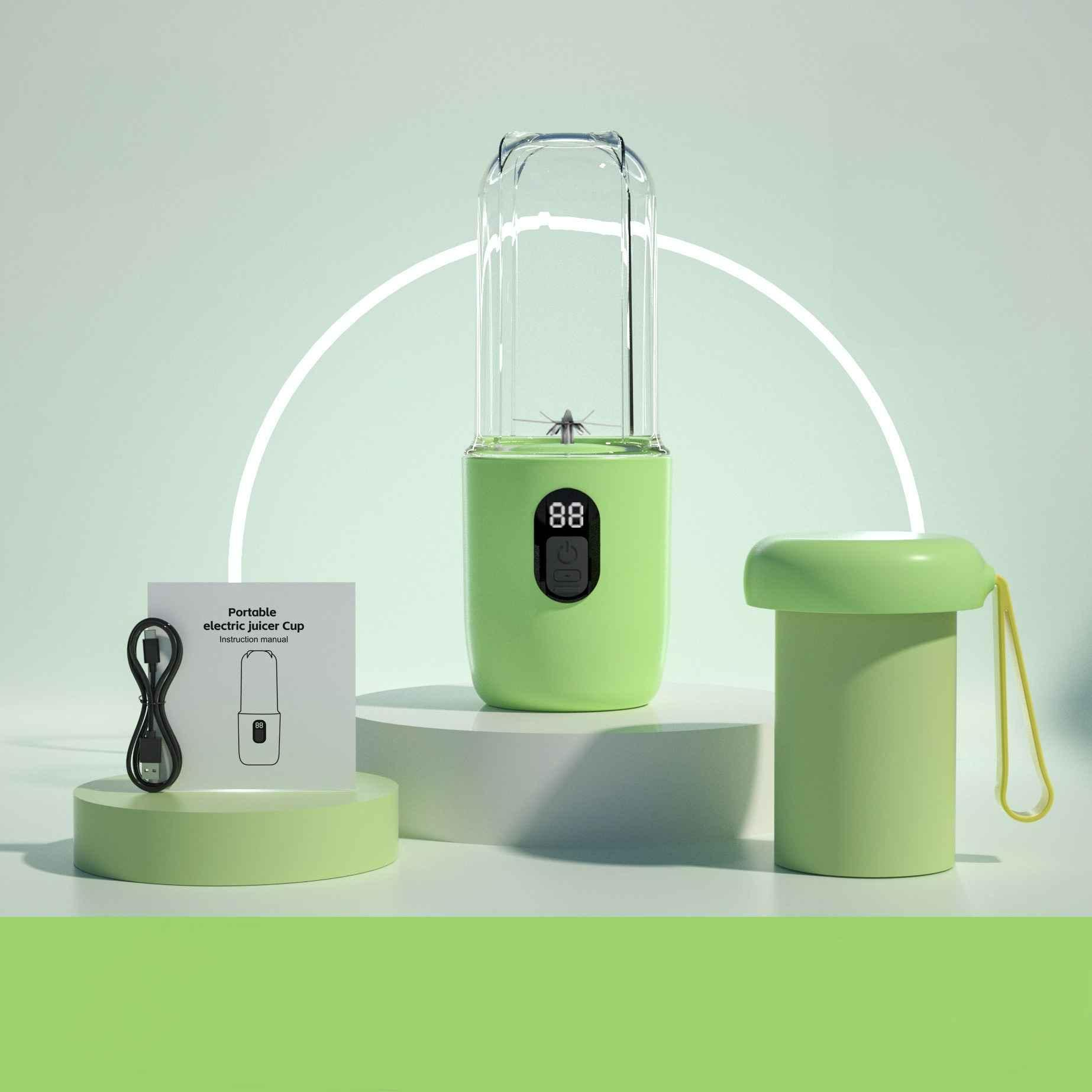 Grüner Mixer, Bedienungsanleitung, Zylinderbecher mit gelbem Deckel und USB-Kabel.