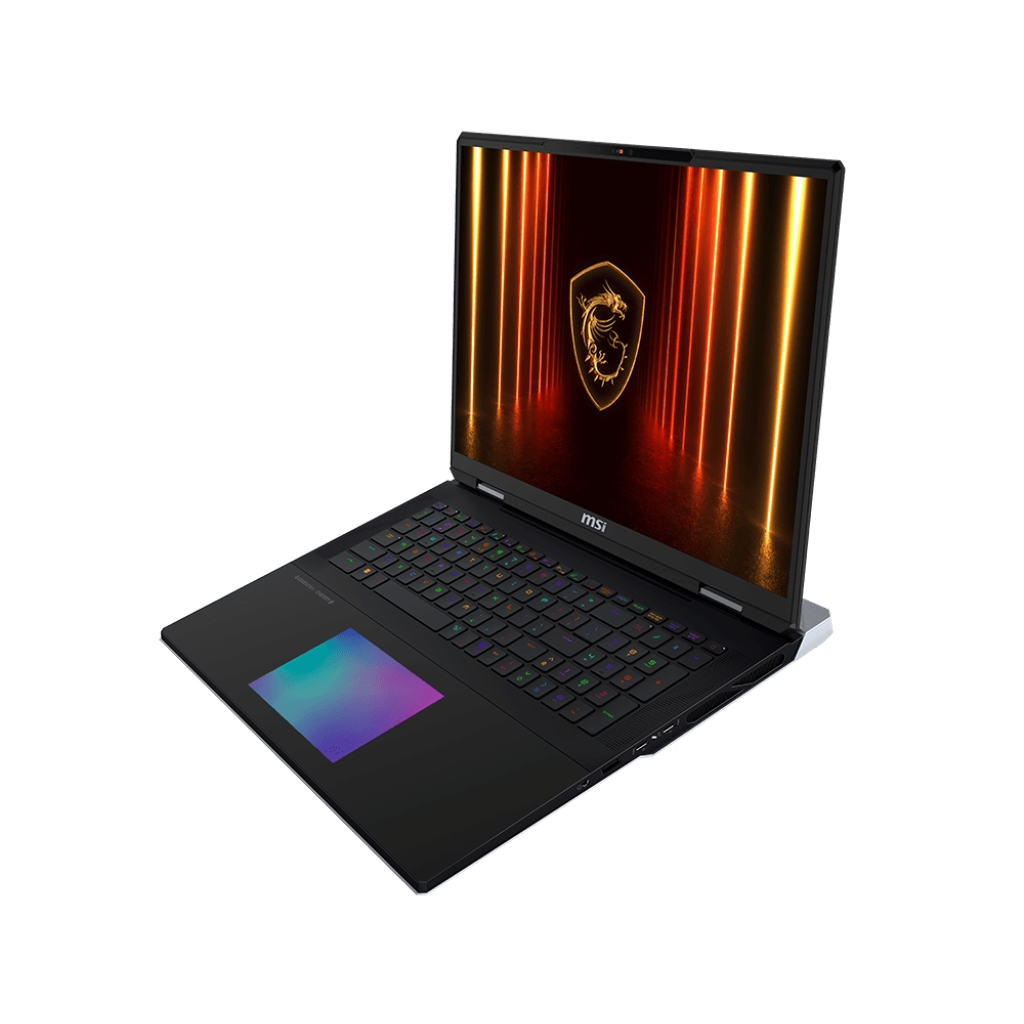 Un laptop nero con logo luminoso sullo schermo, su una superficie bianca, vista angolata.