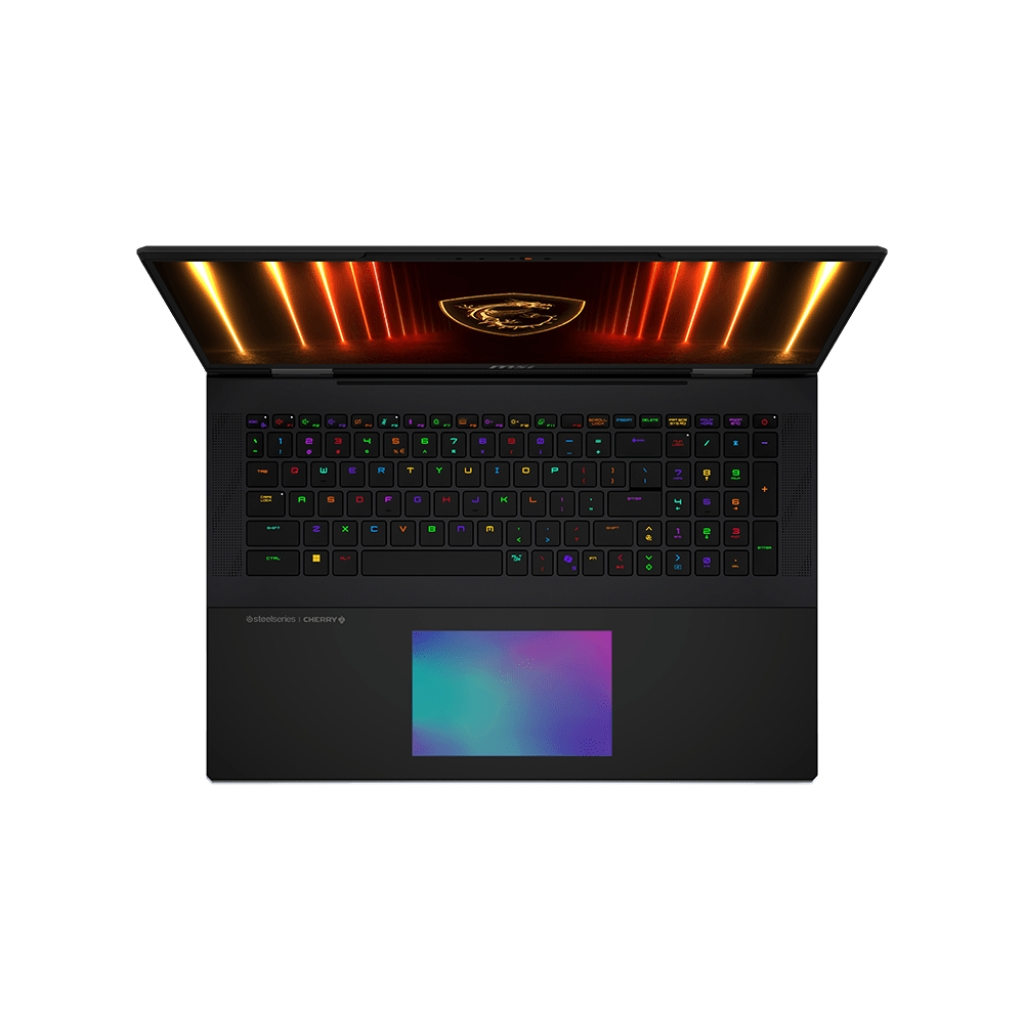 Laptop aperto, vista dall'alto. Tastiera con tasti colorati, touchpad e schermo luminoso. Il laptop è nero.
