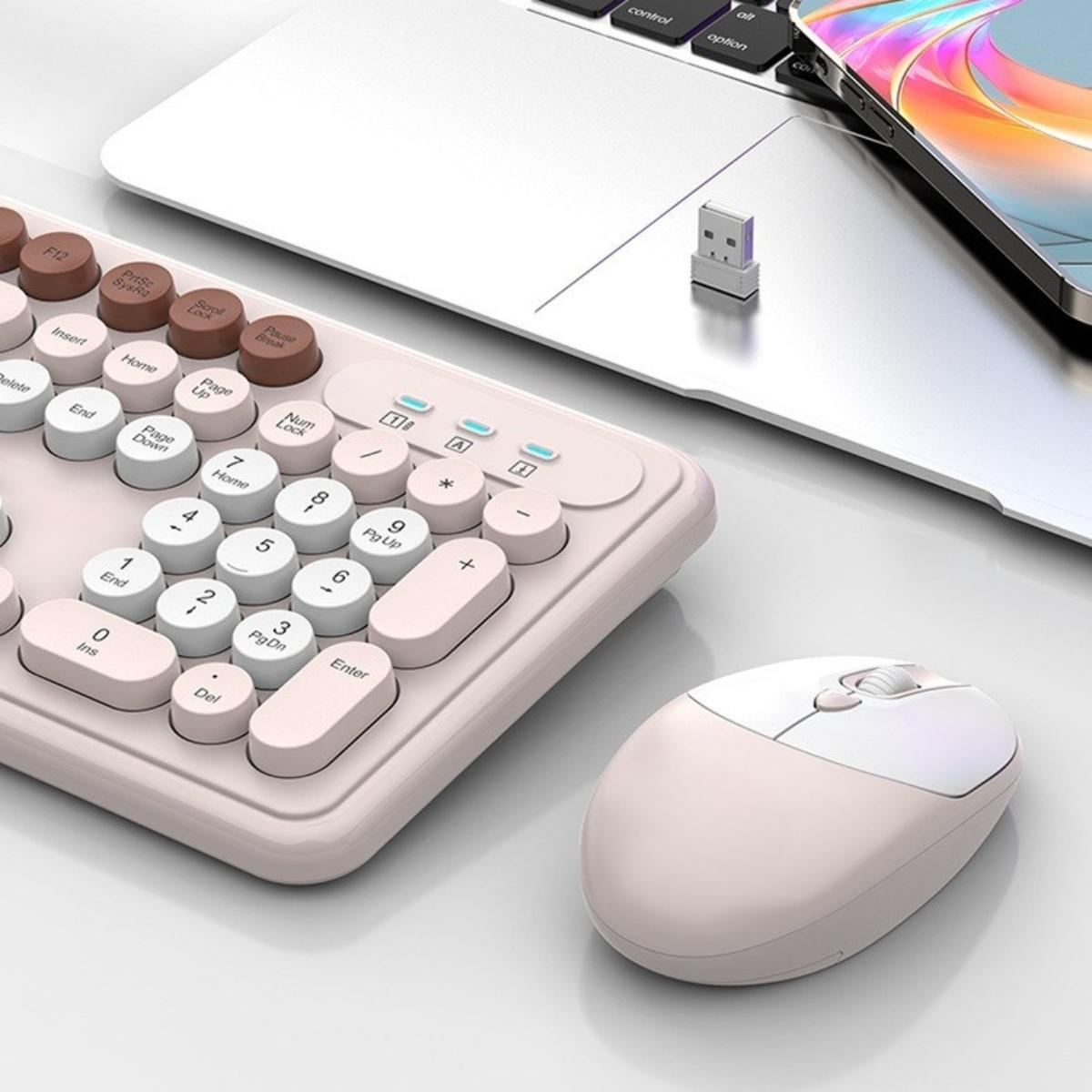 Eine Tastatur und Maus auf einer weißen Oberfläche. Die Tastatur ist weiß und rosa, die Maus ist weiß.