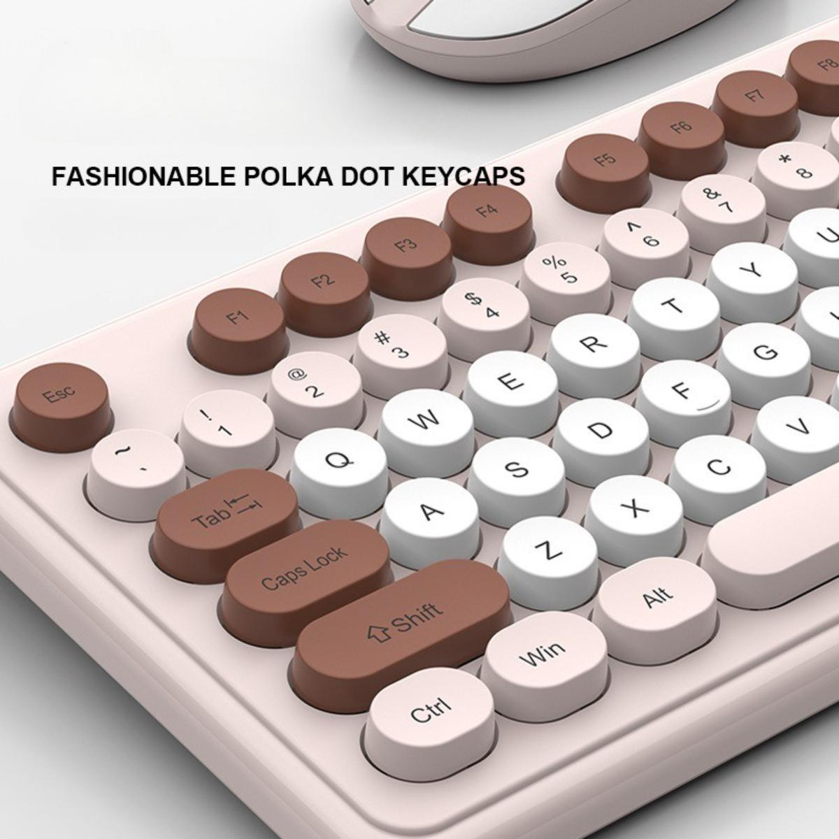 Nahaufnahme einer Tastatur mit runden, zweifarbigen Tasten. Einige Tasten sind braun, andere weiß, mit Text auf jeder Taste.