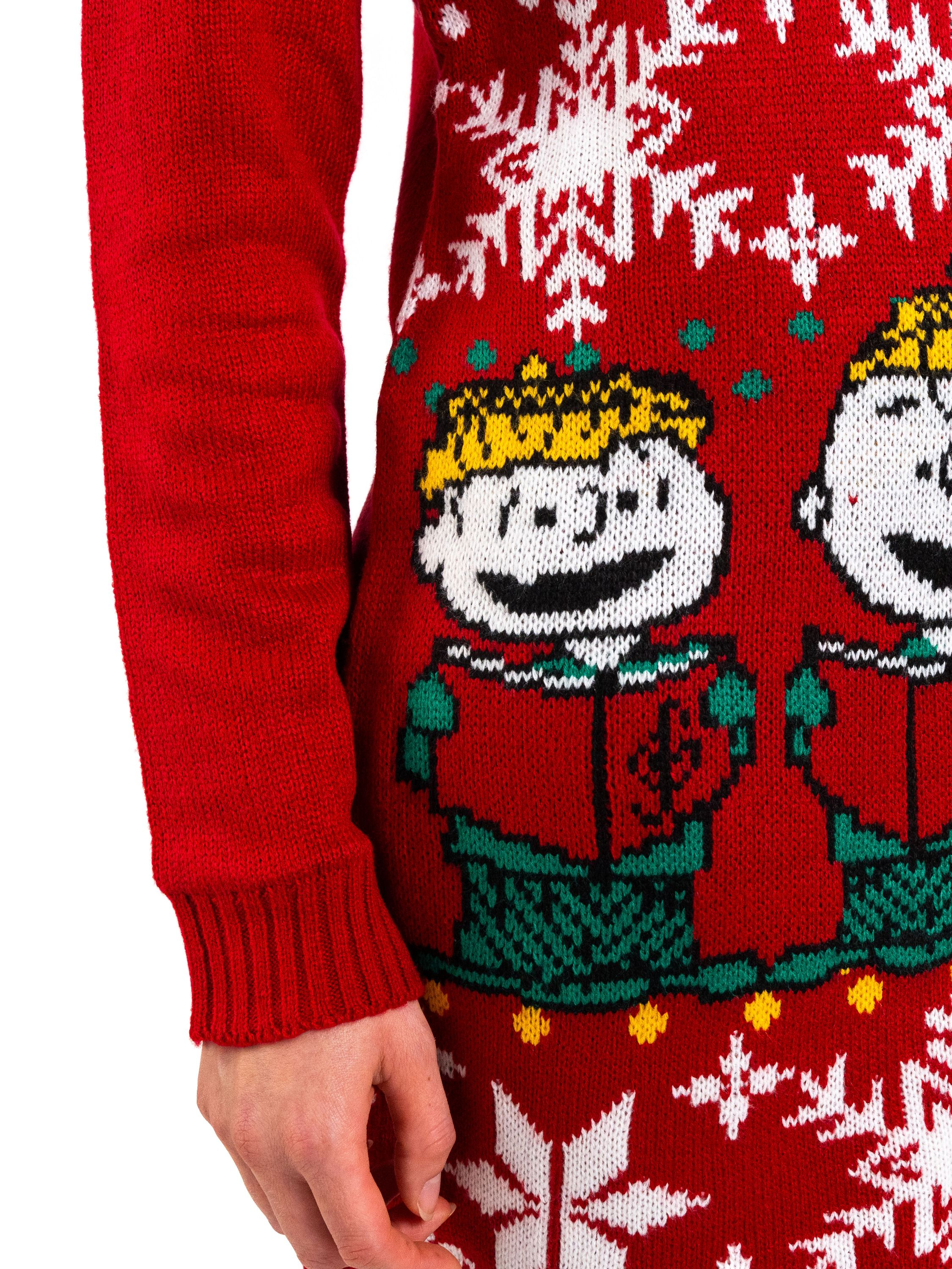 Nahaufnahme eines roten Pullovers mit Zeichentrickfiguren und Schneeflocken. Merkmale sind eine Cartoonfigur mit einem Buch.