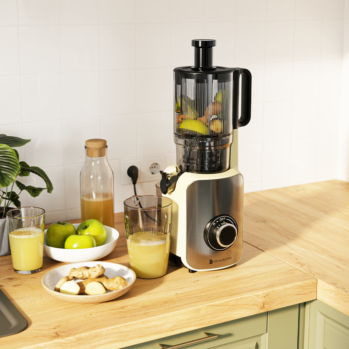 A juicer on a wooden counter with fruits, glasses, and juice. White tile background.