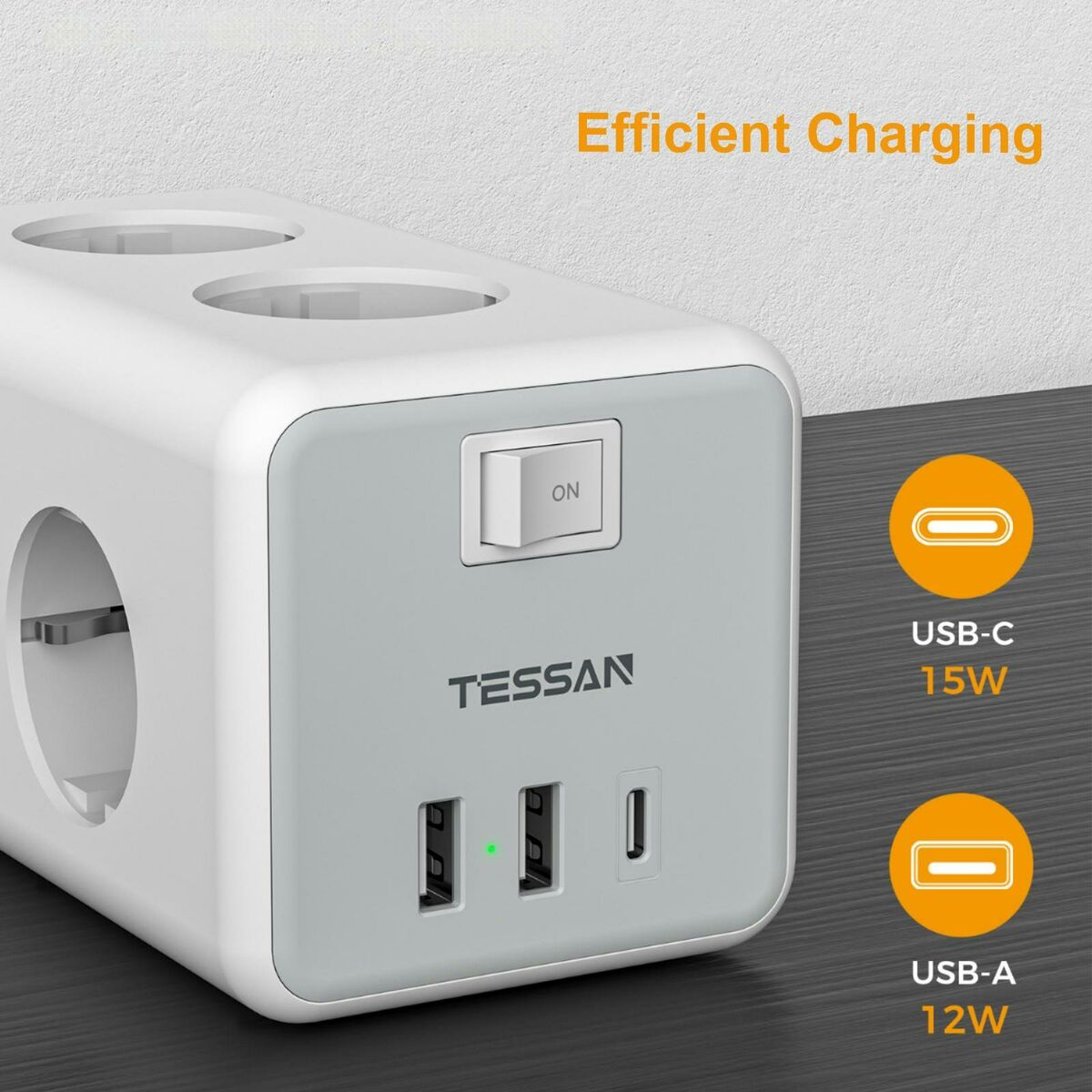 Primo piano di una presa multipla bianca con pulsante di accensione e porte USB, etichettata 'TESSAN'.