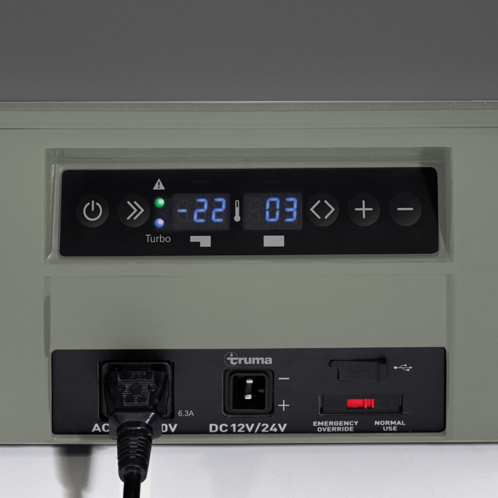 Close-up of a black control panel with a digital display showing -22 degrees. Has buttons and a power input.