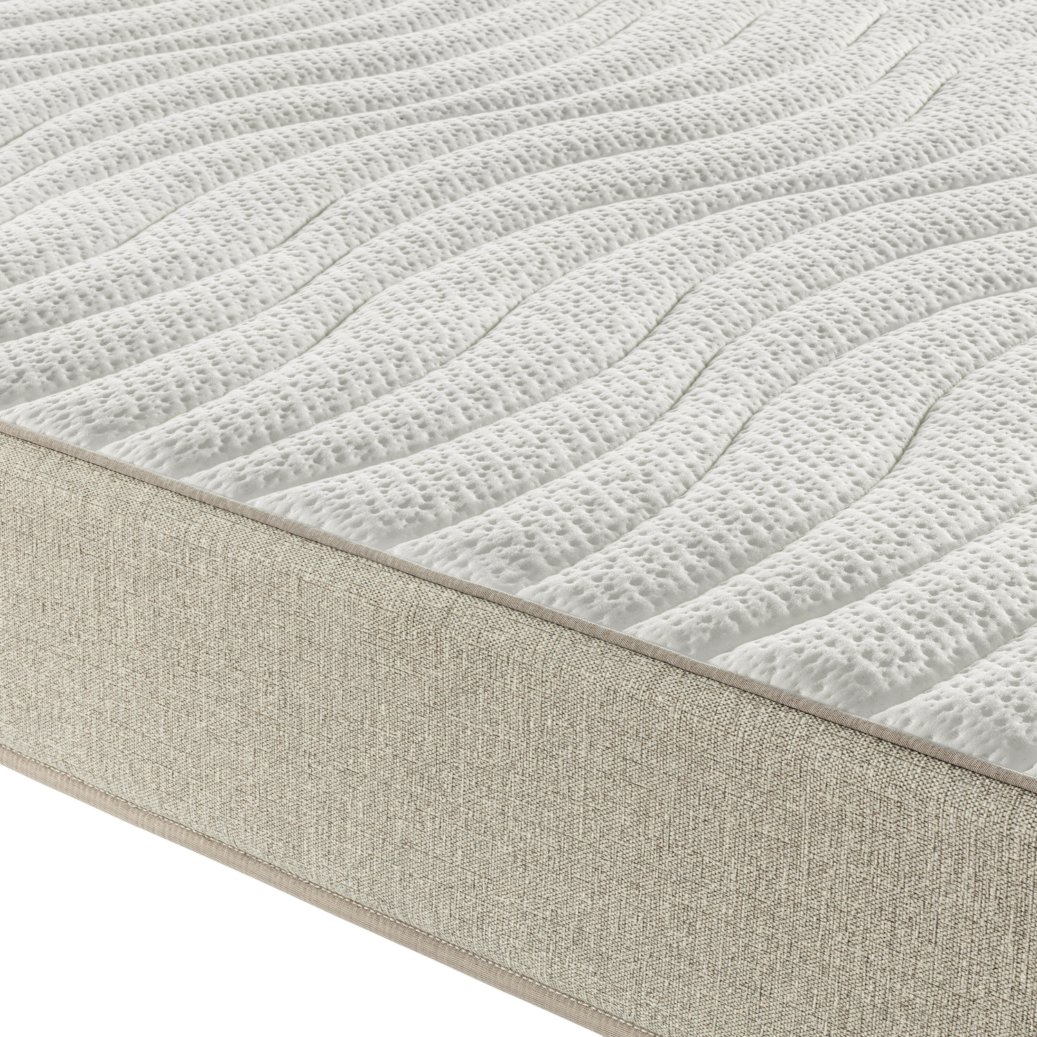 Primer plano de un colchón blanco con parte superior estampada y borde beige. Los patrones son ondulados y texturizados.