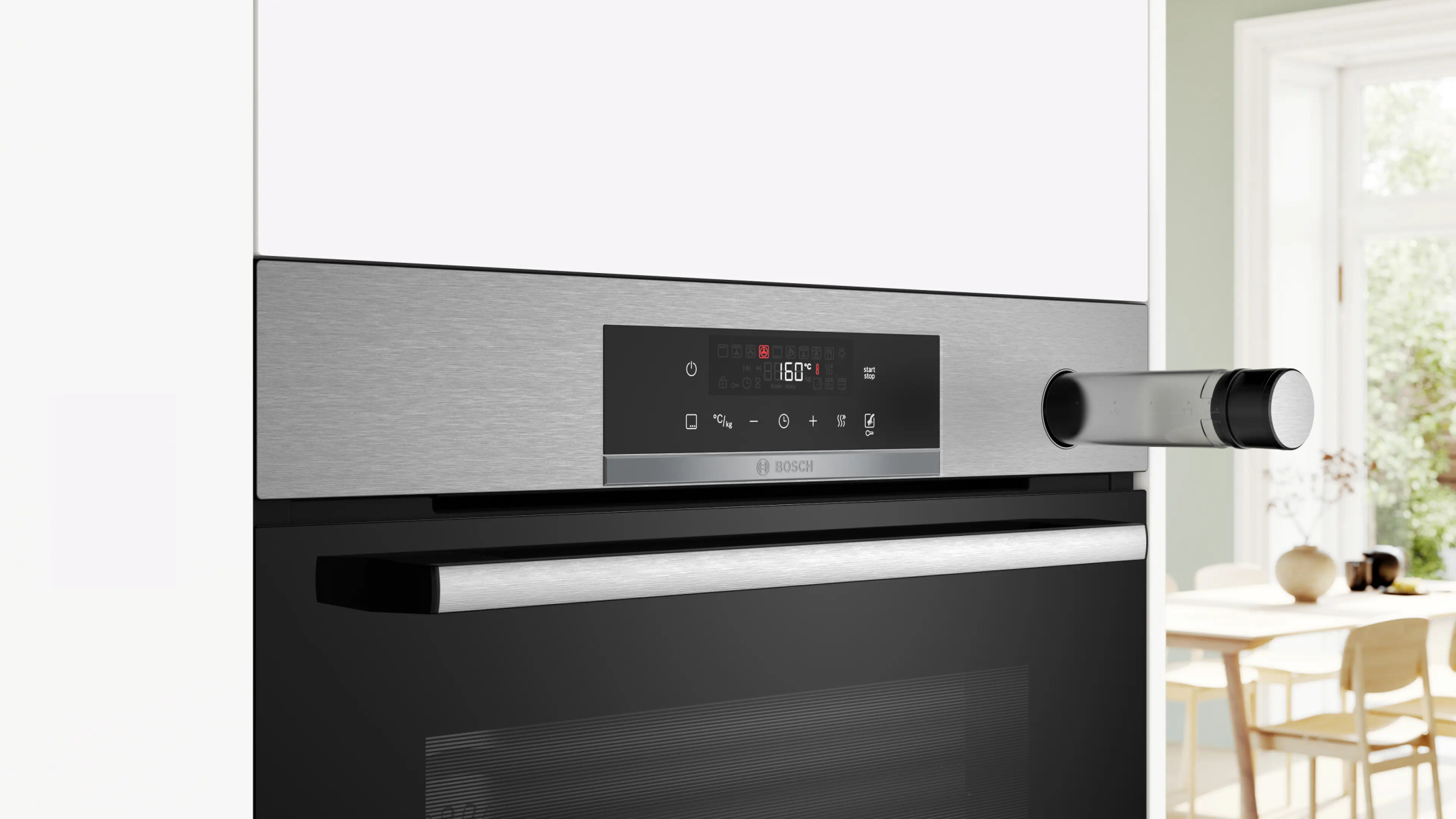 A modern oven with a stainless steel finish and digital display, set against a bright, contemporary kitchen backdrop.
