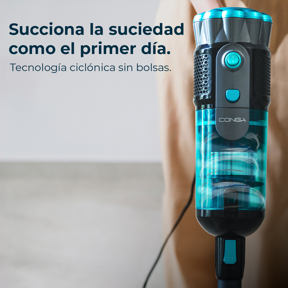 A blue and black vacuum cleaner, close-up, with text describing its features.