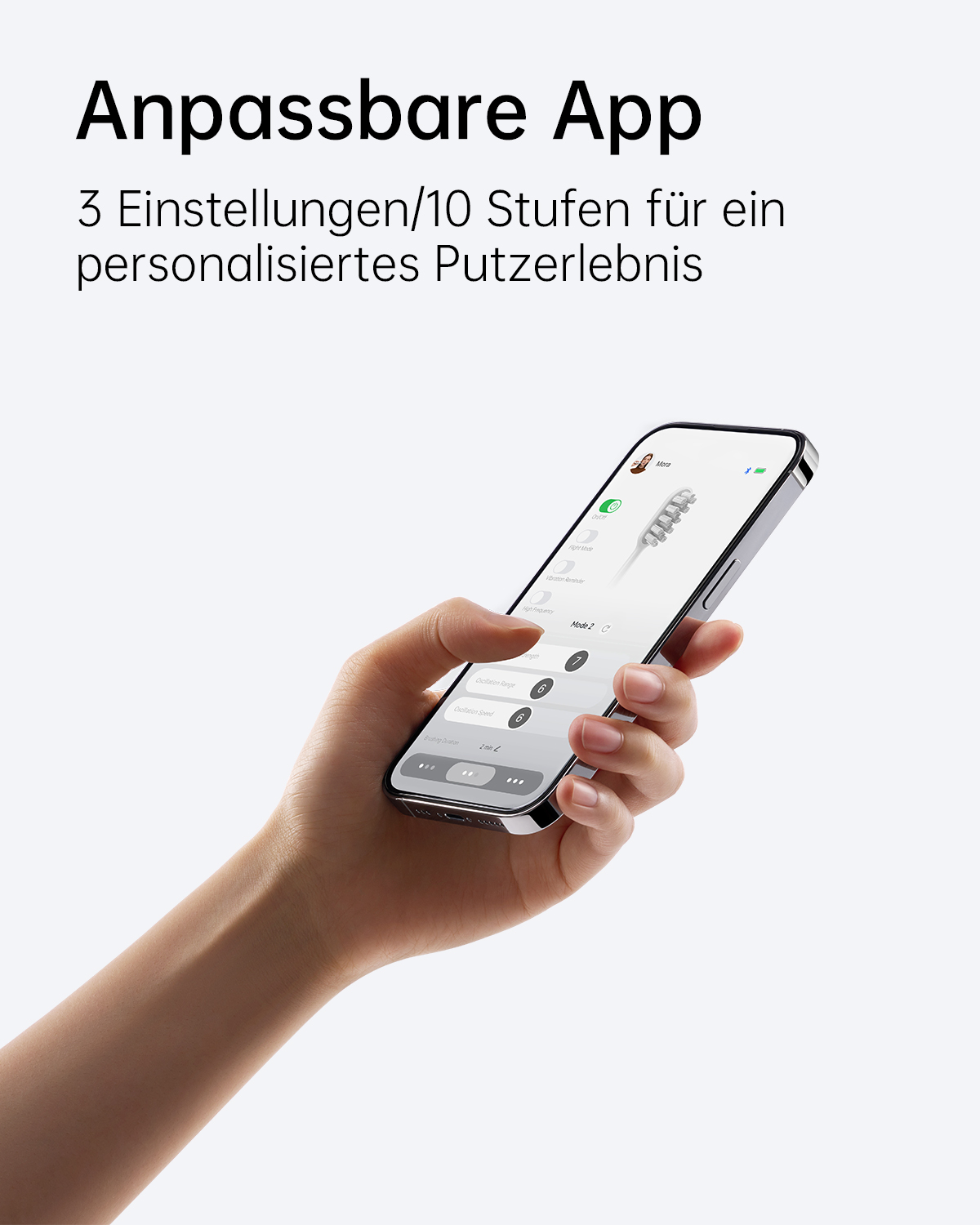 Eine Hand, die ein schwarzes Telefon mit einem Zahnbildschirm hält. Der Hintergrund ist weiß.