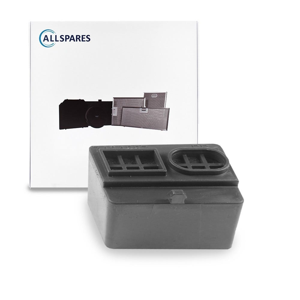 Ein schwarzes Plastikteil mit einer weißen Box mit Text dahinter.