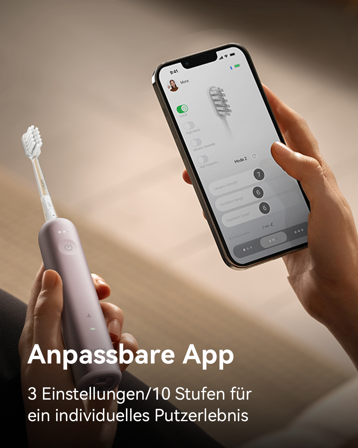 Nahaufnahme einer Hand, die ein Telefon mit einer Zahnbürsten-App und Einstellungen hält.