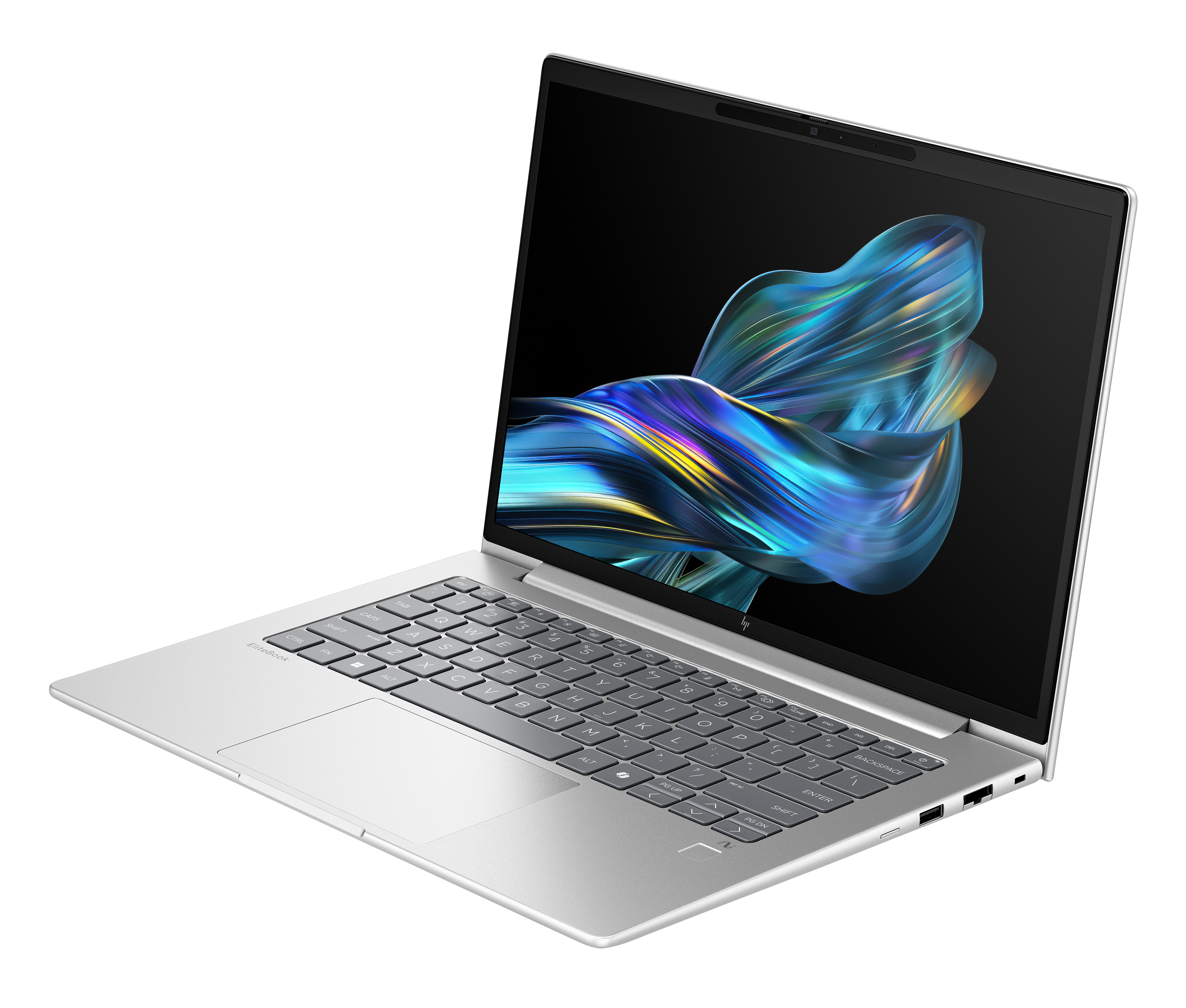 Un laptop argentato, aperto, che mostra un design astratto colorato sullo schermo. La tastiera è visibile.
