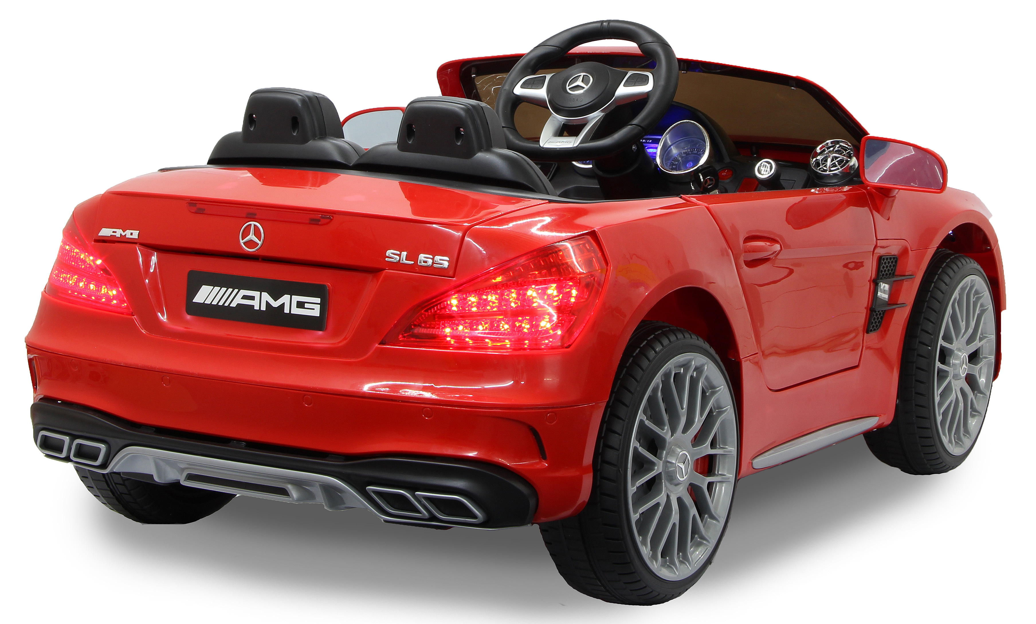 Rückansicht eines roten Spielzeug Mercedes-Benz SL 65 AMG Roadsters. Rücklichter leuchten, AMG-Logo sichtbar.