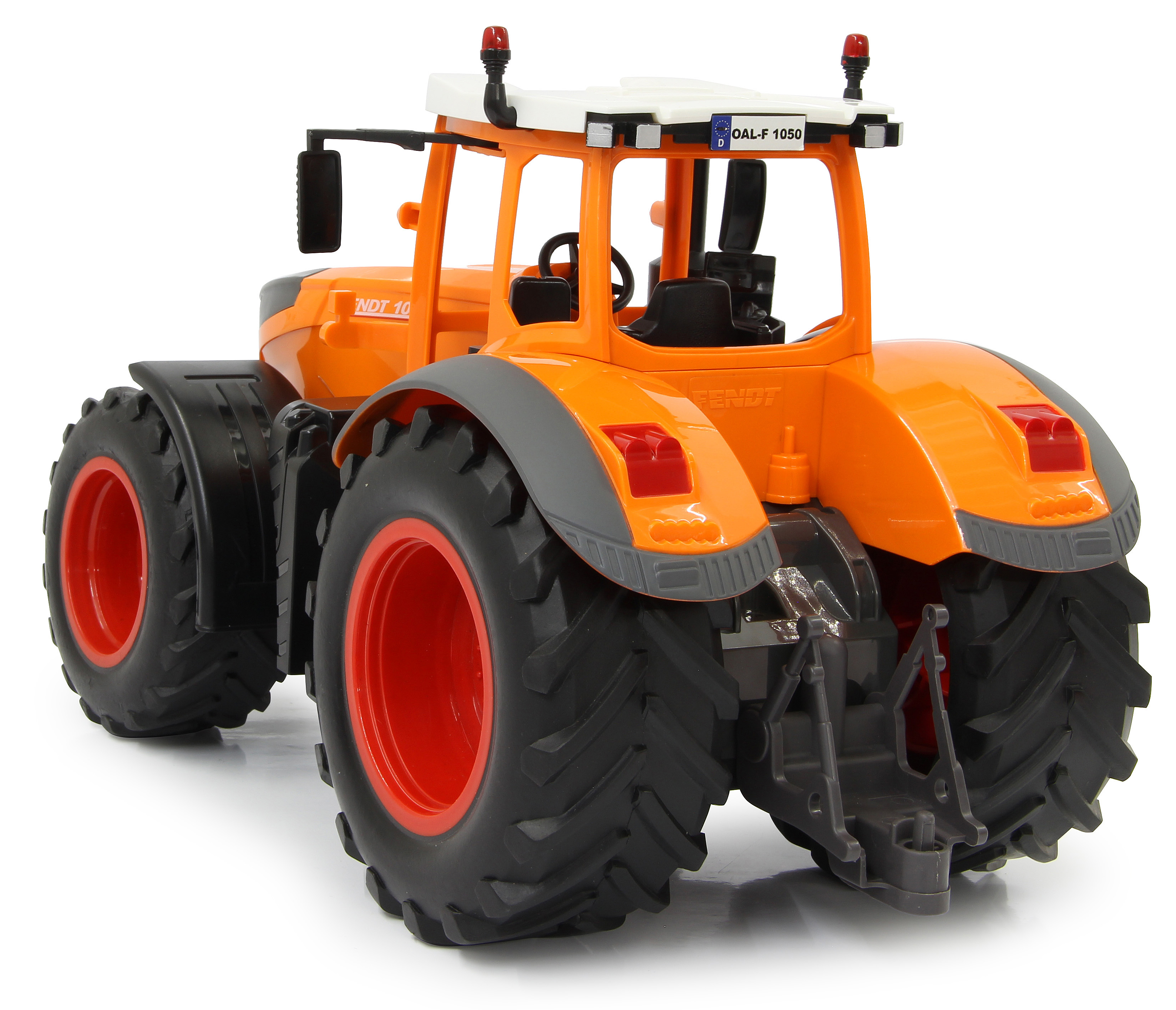 Ein orangefarbener Spielzeugtraktor mit grauen und roten Details. Der Traktor ist mit FENDT und NDT 10 beschriftet.